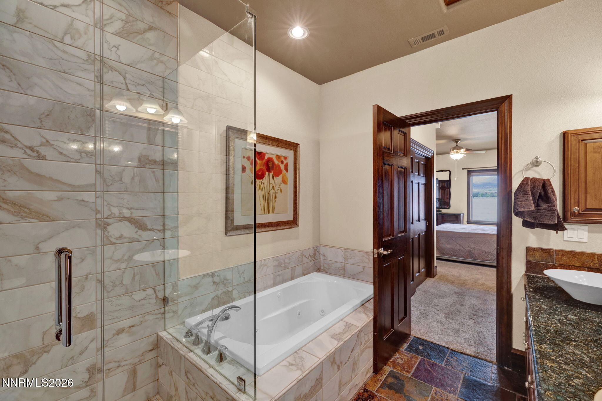 900 South Meadows Parkway, Unit 5121 Reno, NV 89521 - Photo 19 of 39 a bathroom with a tub and shower