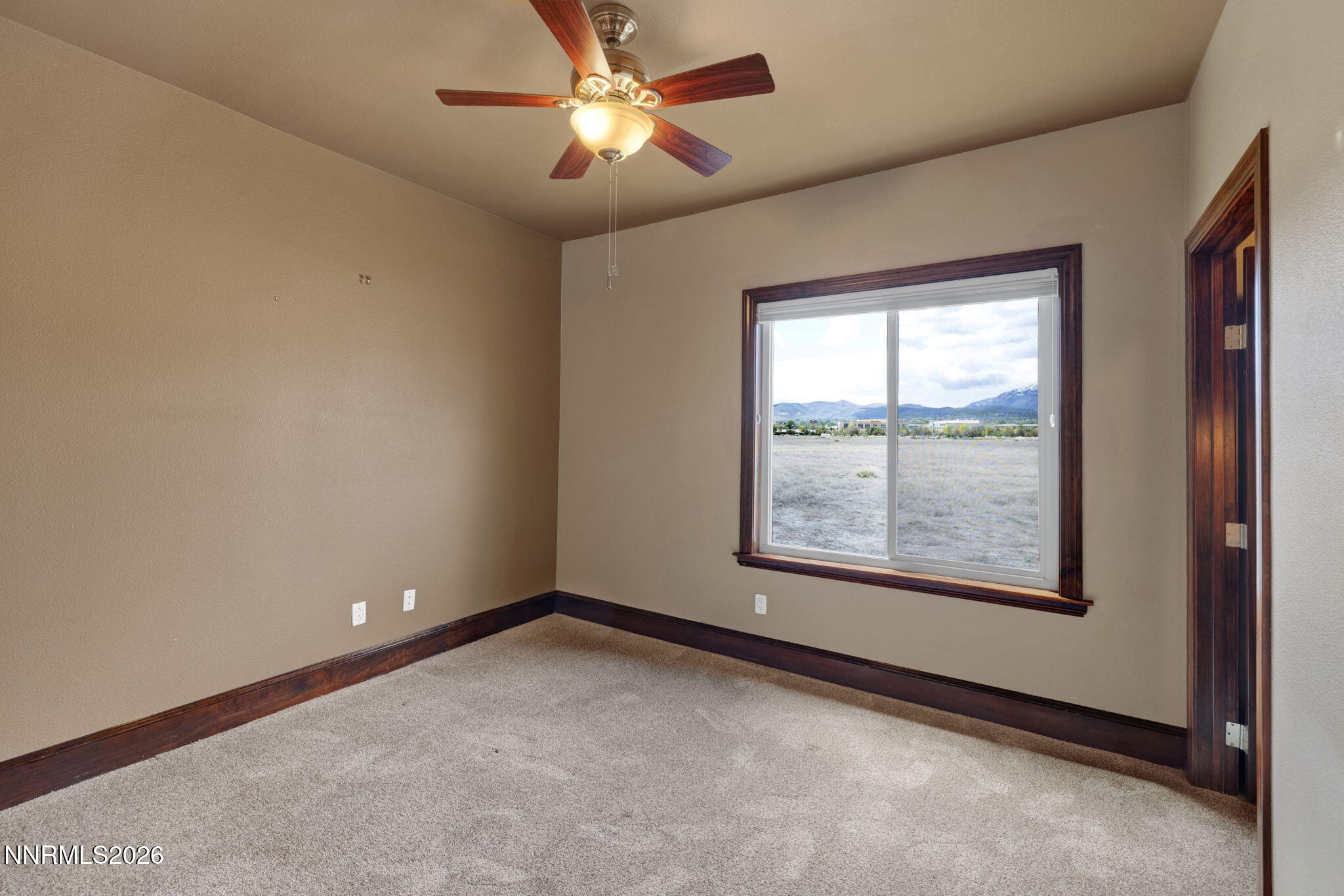 900 South Meadows Parkway, Unit 5121 Reno, NV 89521 - Photo 20 of 39 an empty room with a window and a fan