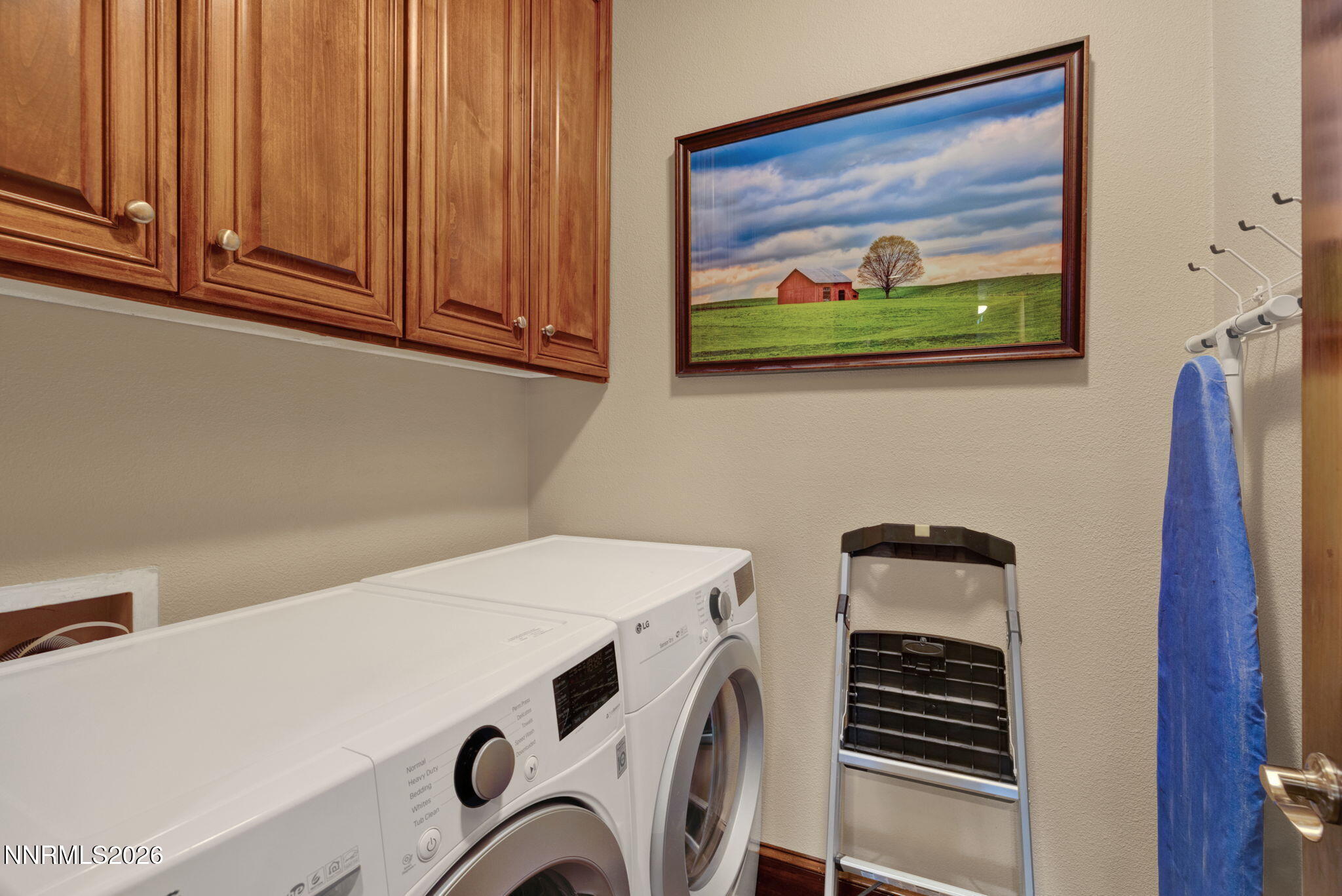 900 South Meadows Parkway, Unit 5121 Reno, NV 89521 - Photo 23 of 39 a utility room with dryer washer and a view of living room