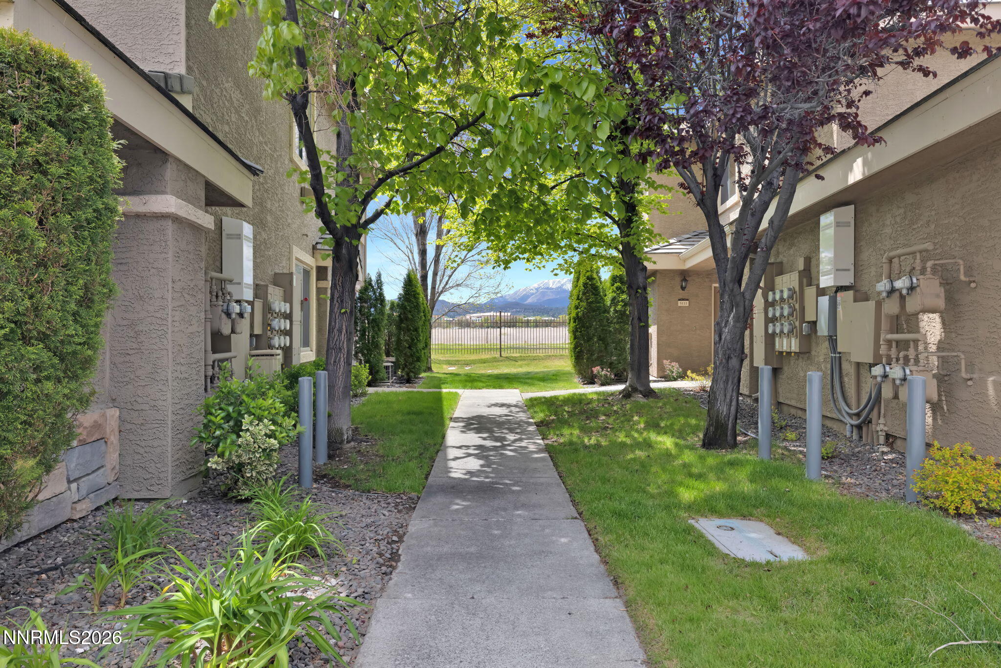 900 South Meadows Parkway, Unit 5121 Reno, NV 89521 - Photo 3 of 39 a front view of a house with a yard