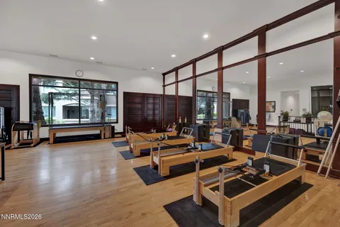 a room with gym equipment and a large window