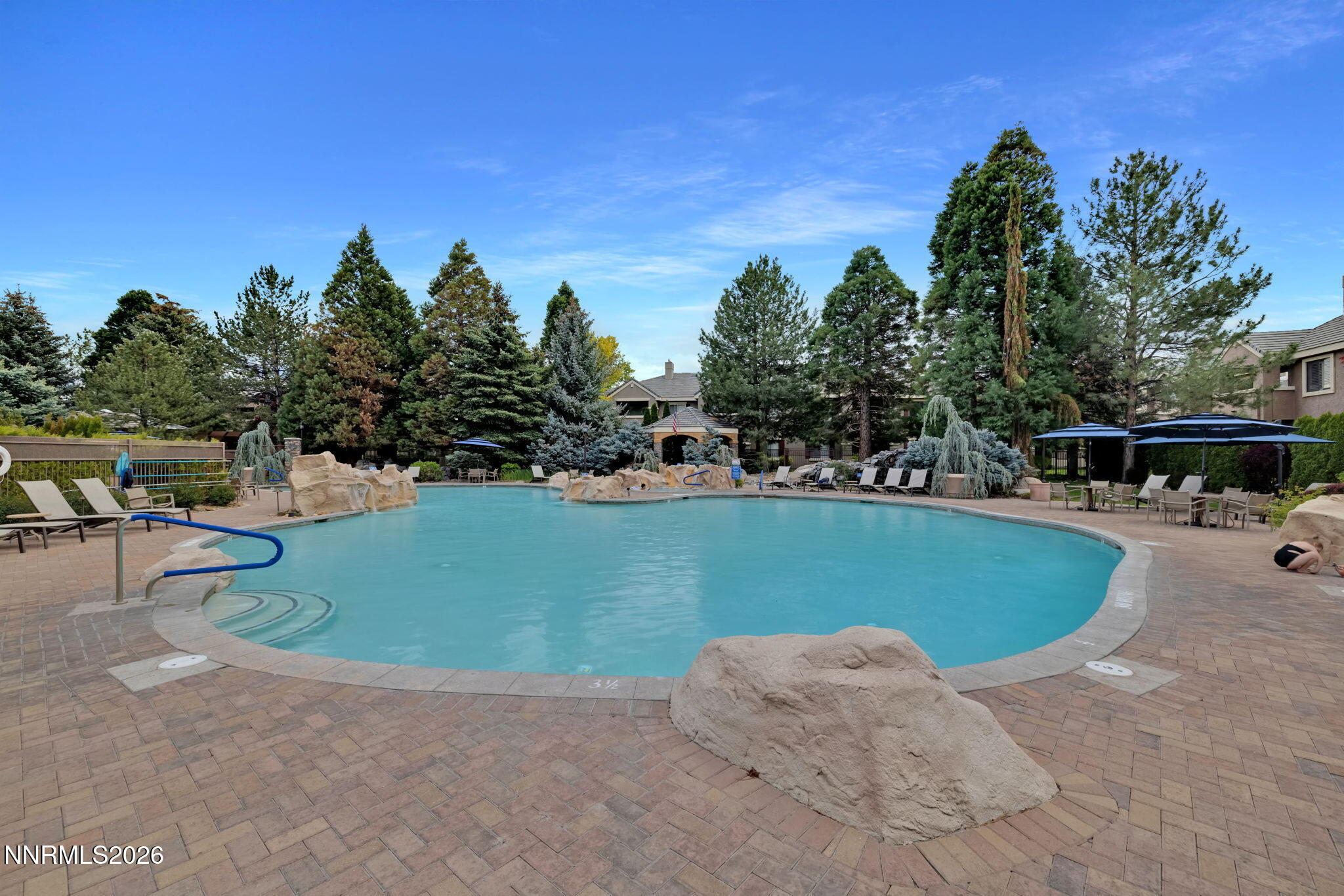 900 South Meadows Parkway, Unit 5121 Reno, NV 89521 - Photo 38 of 39 a view of a swimming pool and trees in the background