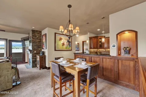 a dining room with furniture and chandelier