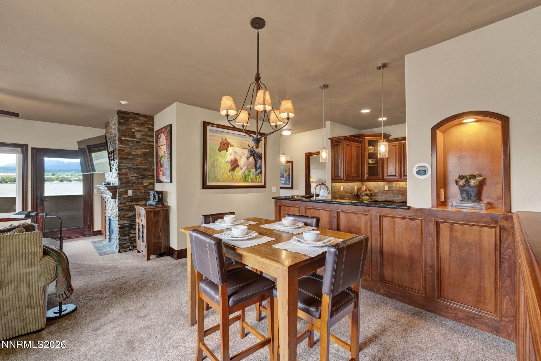 900 South Meadows Parkway, Unit 5121 Reno, NV 89521 - Photo 6 of 39 a dining room with furniture and chandelier