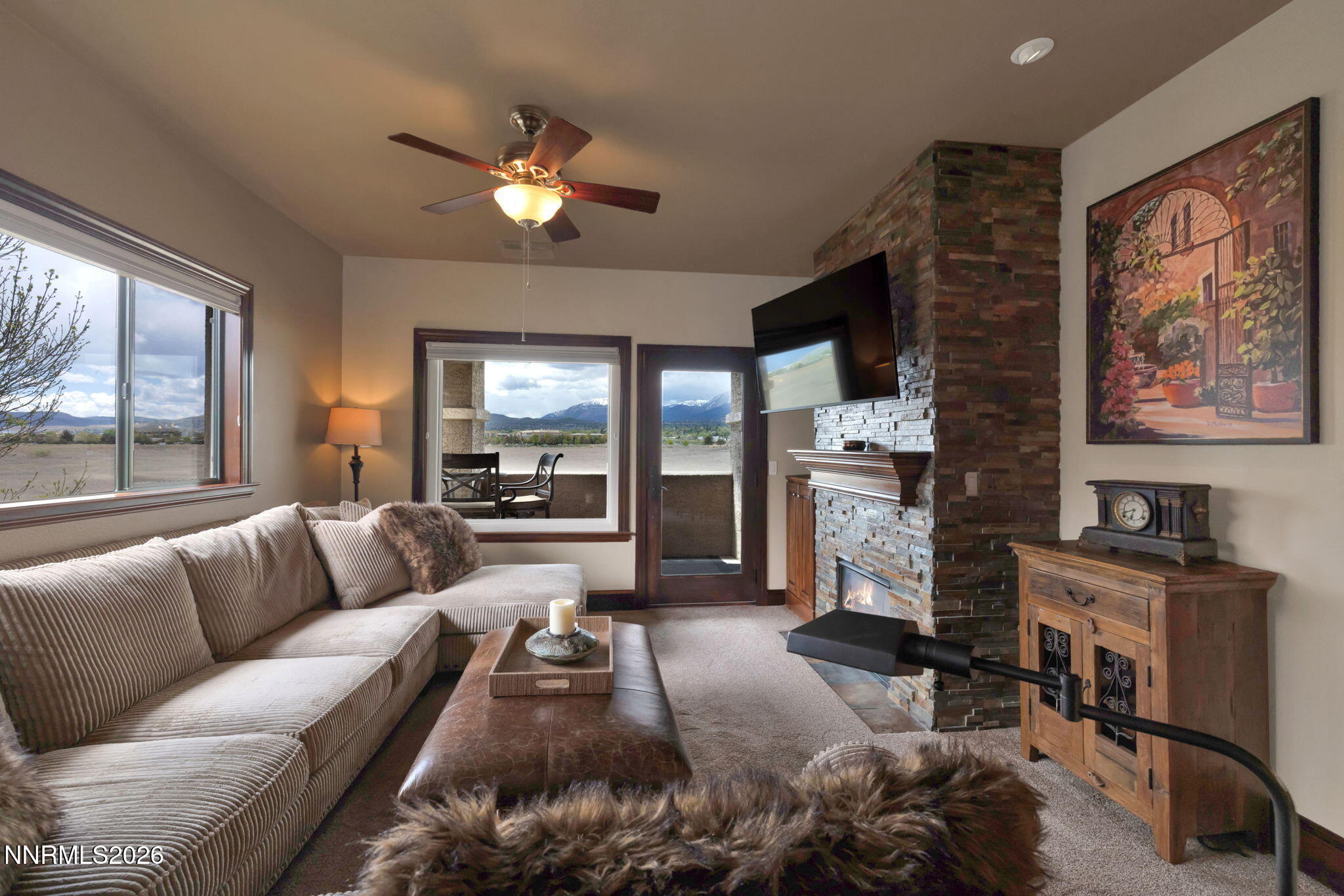 900 South Meadows Parkway, Unit 5121 Reno, NV 89521 - Photo 7 of 39 a living room with furniture and a fireplace
