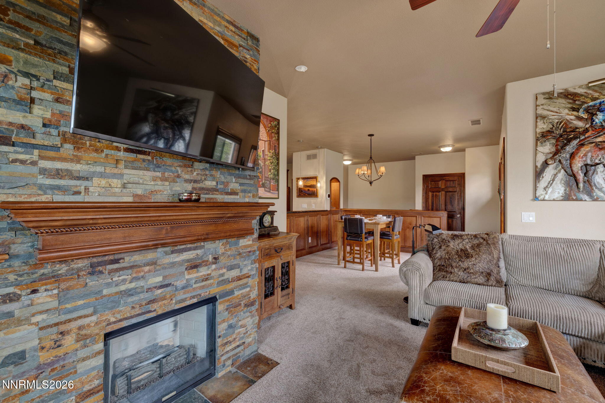 900 South Meadows Parkway, Unit 5121 Reno, NV 89521 - Photo 9 of 39 a living room with furniture a flat screen tv and kitchen view