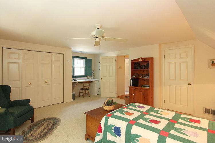 1200 Ashton Road Ashton, MD 20861 - Photo 14 of 30 a bedroom with a bed and furniture