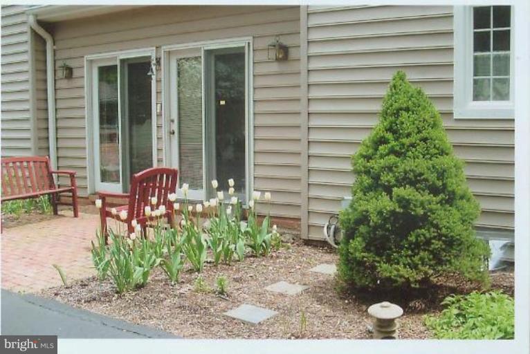 1200 Ashton Road Ashton, MD 20861 - Photo 23 of 30 a potted plant sitting in front of a house