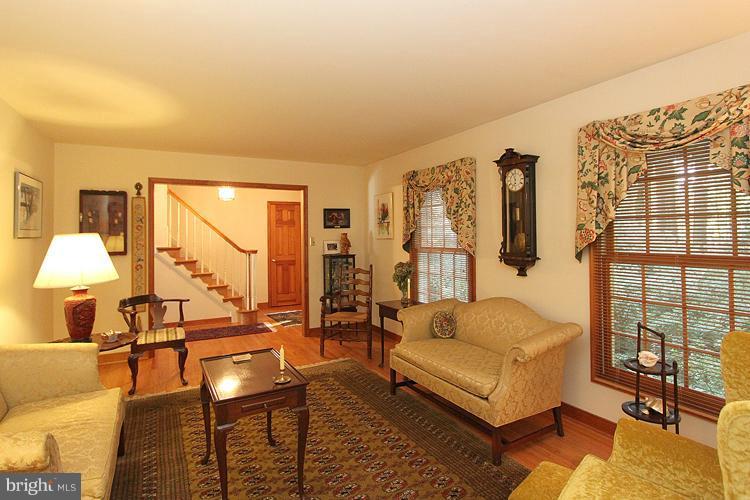 1200 Ashton Road Ashton, MD 20861 - Photo 4 of 30 a living room with furniture and a large window