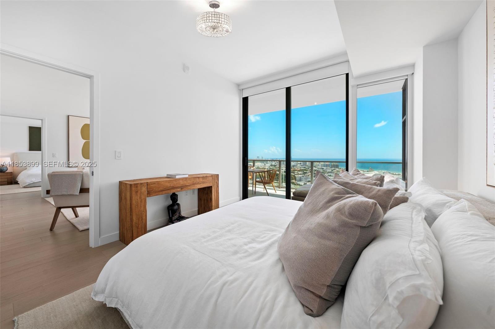 500 Alton Road, Unit 3604 Miami Beach, FL 33139 - Photo 14 of 45 a bedroom with a large bed and a window