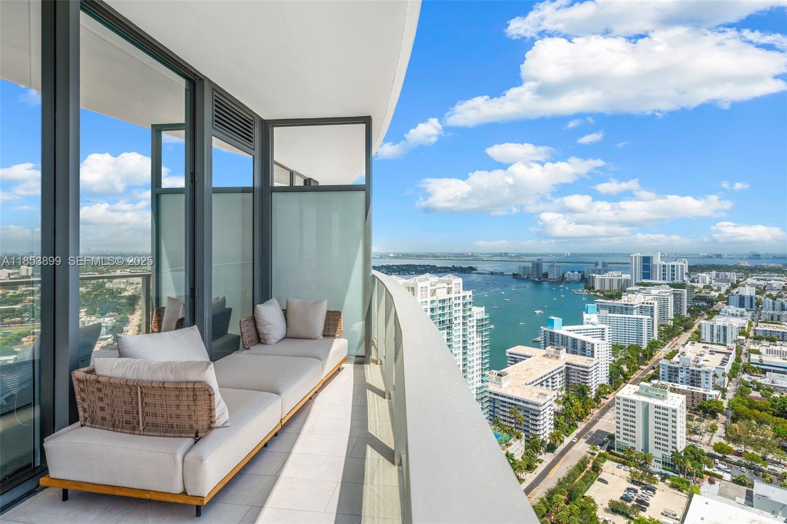 500 Alton Road, Unit 3604 Miami Beach, FL 33139 - Photo 20 of 45 a balcony with furniture and city view