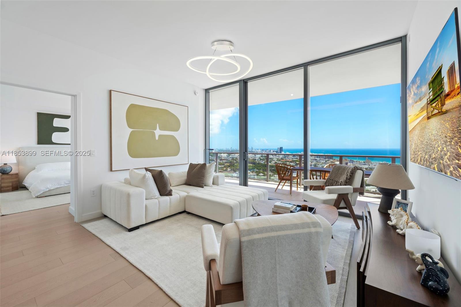500 Alton Road, Unit 3604 Miami Beach, FL 33139 - Photo 2 of 45 a living room with furniture and a large window