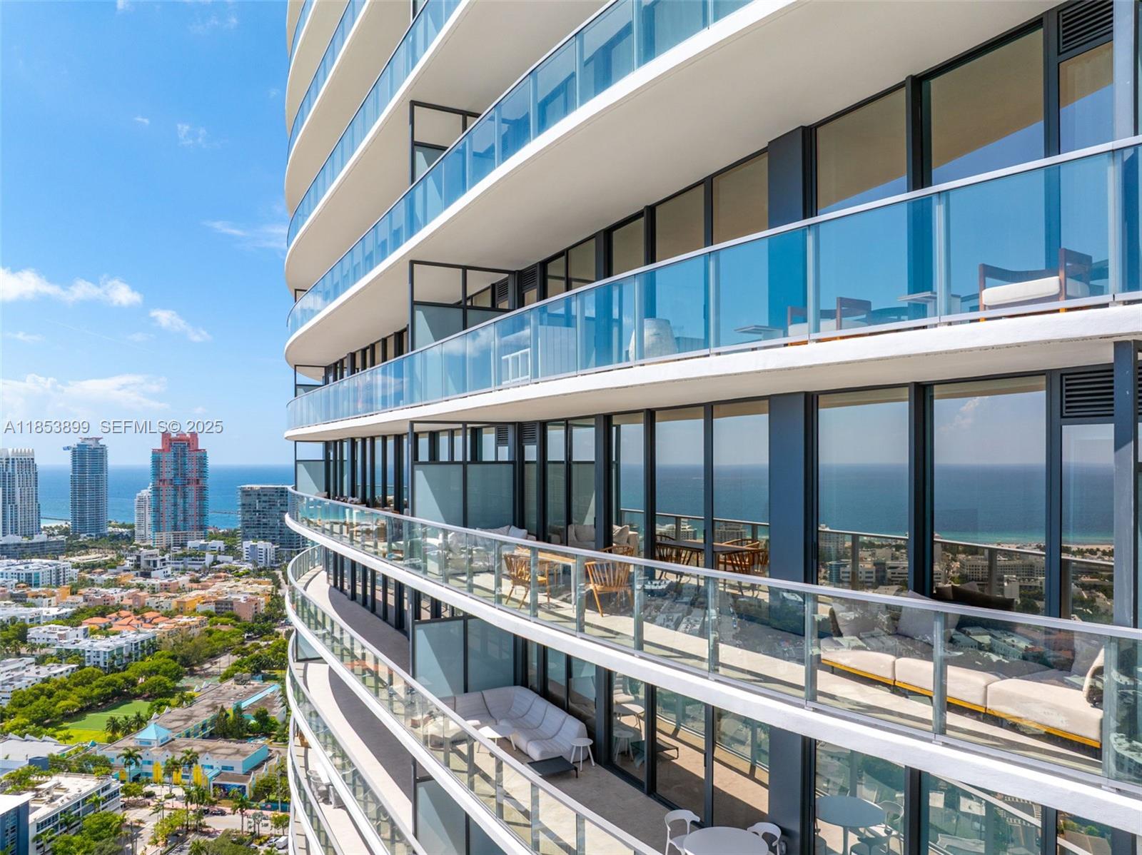 500 Alton Road, Unit 3604 Miami Beach, FL 33139 - Photo 36 of 45 a view of a balcony with a large window and wooden floor