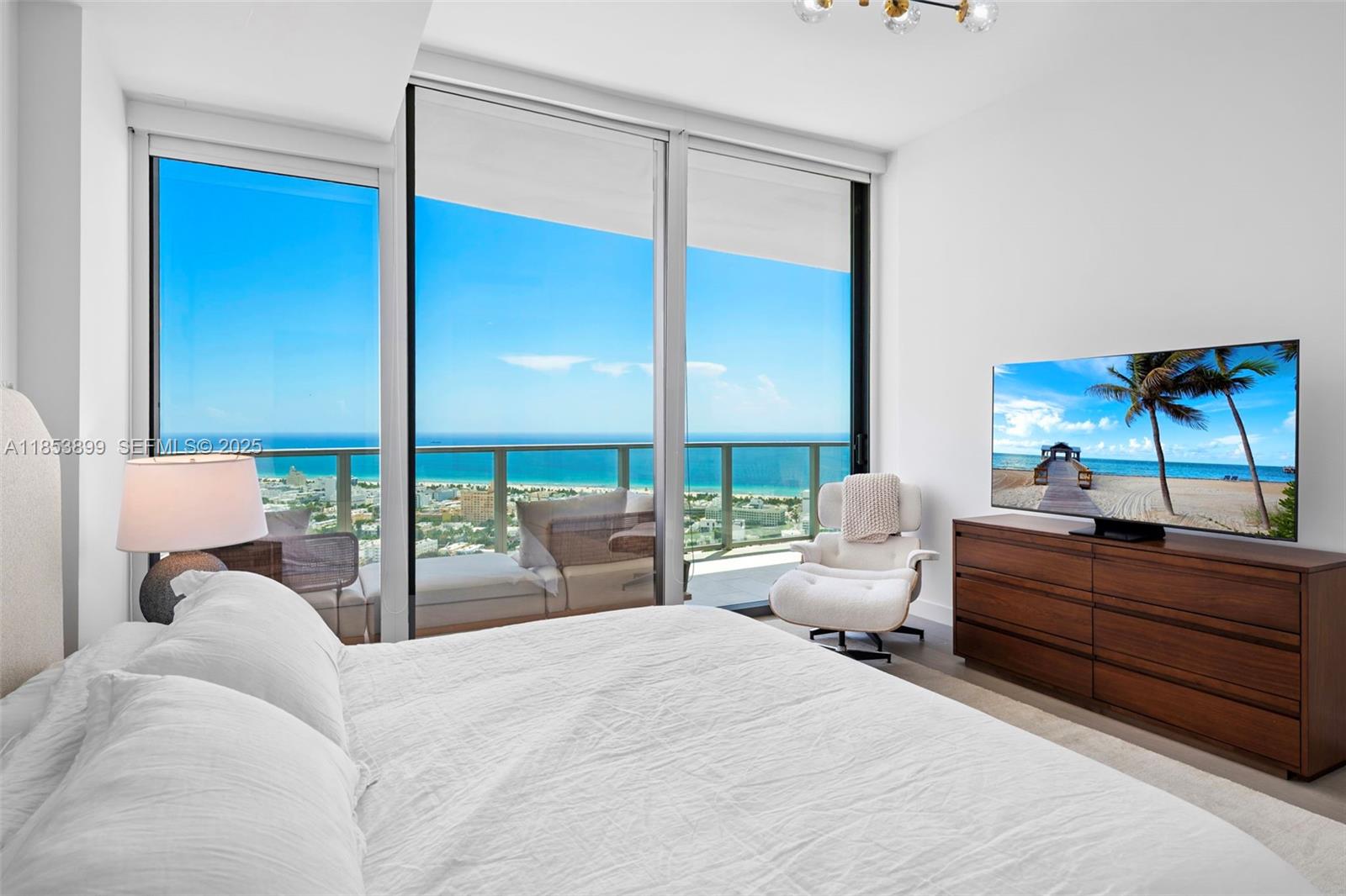 500 Alton Road, Unit 3604 Miami Beach, FL 33139 - Photo 10 of 45 a bedroom with a bed and large window