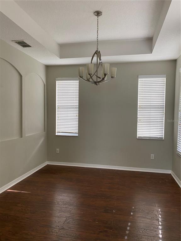 13638 Ancilla Boulevard Windermere, FL 34786 - Photo 14 of 16 a view of a room with wooden floor air conditioner and windows