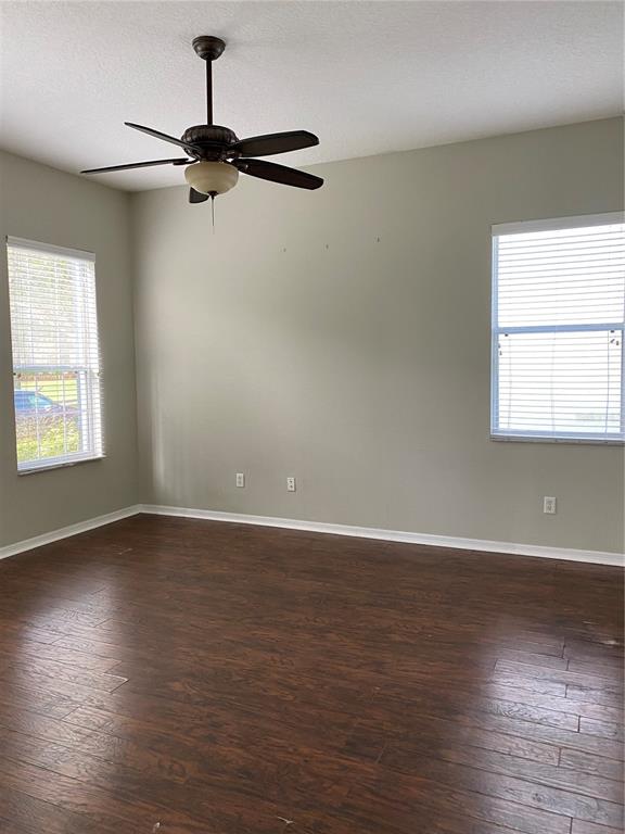 13638 Ancilla Boulevard Windermere, FL 34786 - Photo 15 of 16 a view of an empty room with wooden floor and a window