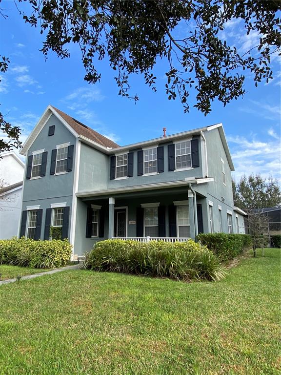 13638 Ancilla Boulevard Windermere, FL 34786 - Photo 2 of 16 a front view of a house with a garden