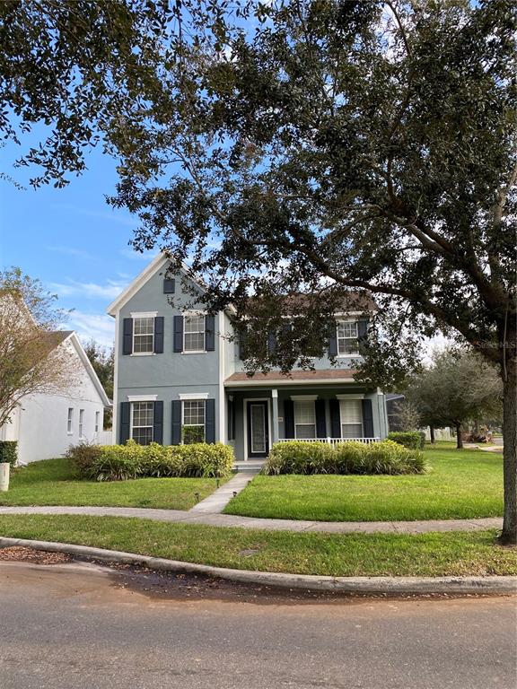 13638 Ancilla Boulevard Windermere, FL 34786 - Photo 3 of 16 a front view of a house with a garden