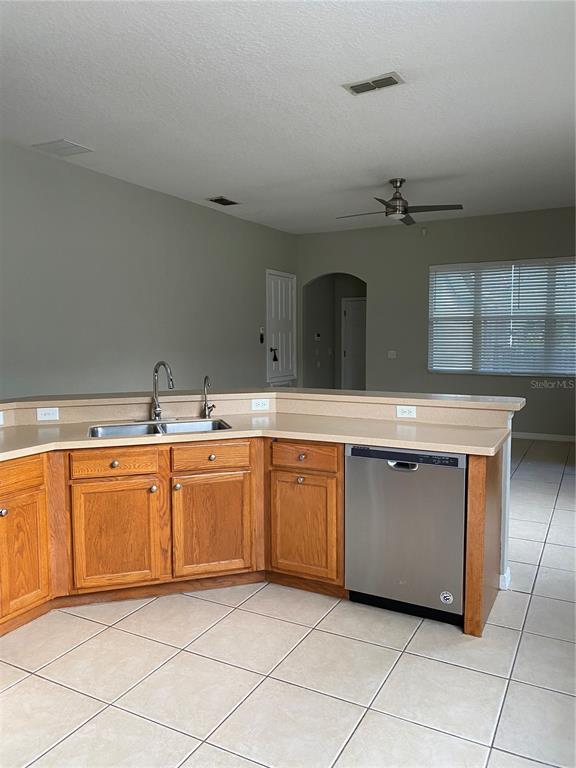 13638 Ancilla Boulevard Windermere, FL 34786 - Photo 6 of 16 a spacious bathroom with a granite countertop sink and a mirror