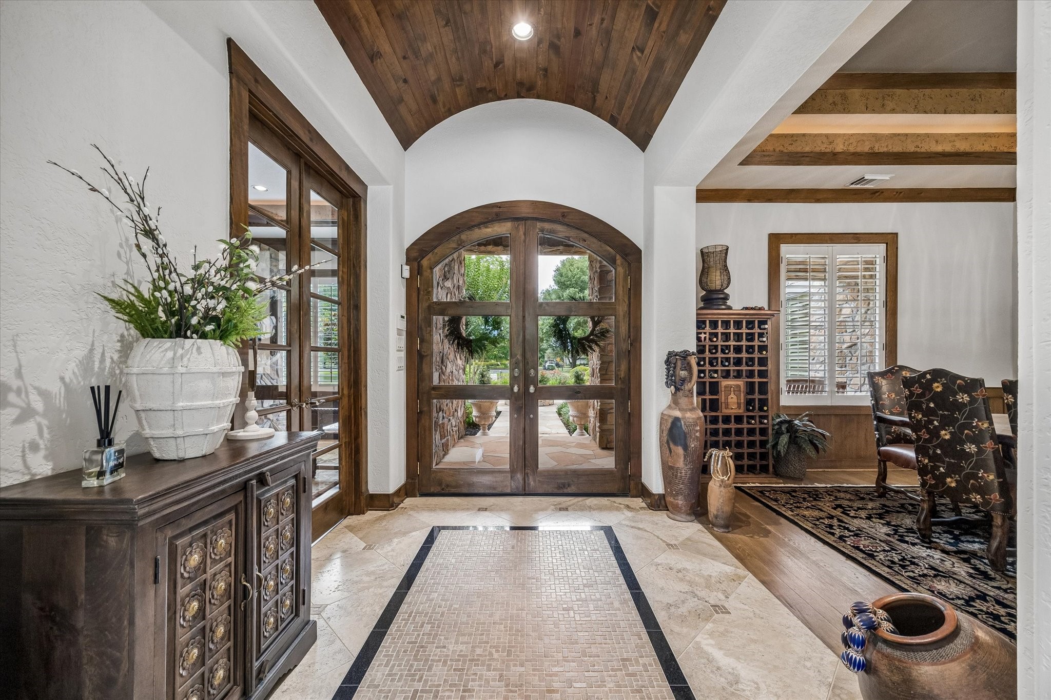 32102 Fulbrook Commons Fulshear, TX 77441 - Photo 4 of 50 The impressive foyer welcomes guests with soaring ceilings, rich wood accents, and elegant architectural details. Stunning entryway!