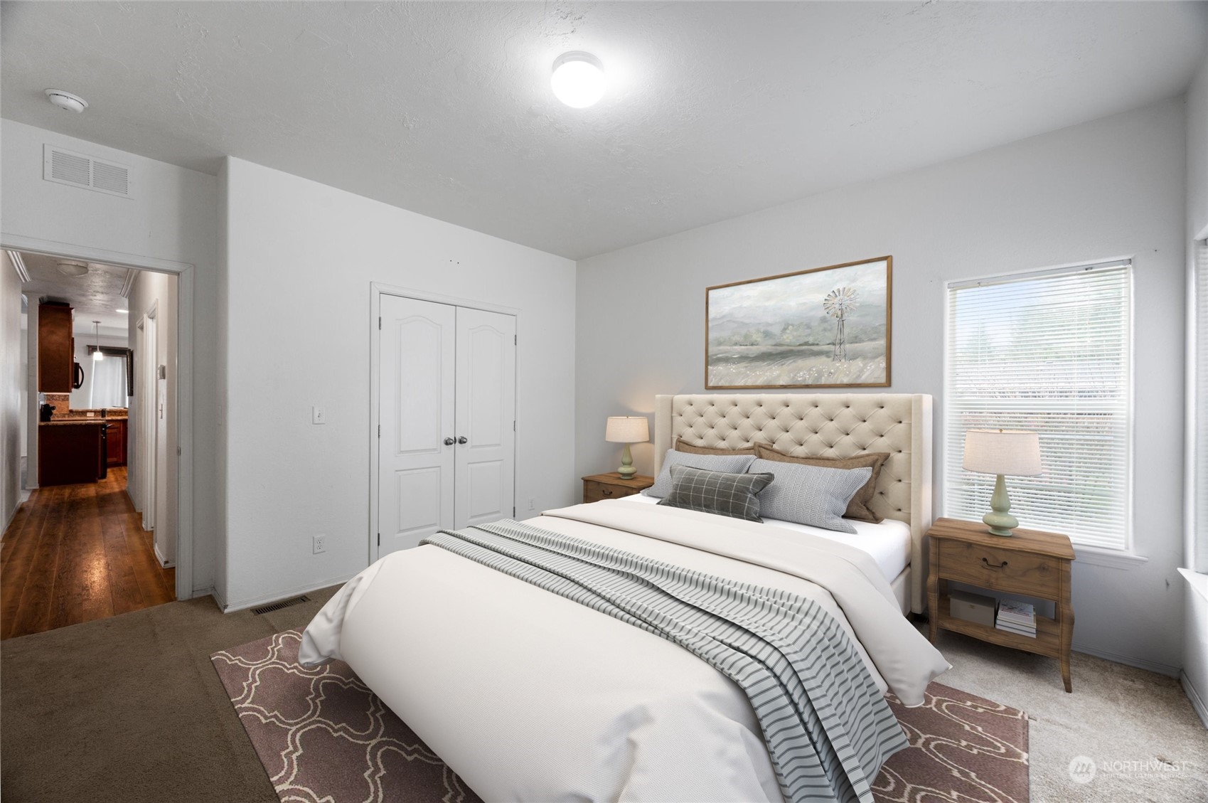 700 North Reed Street, Unit 21 Sedro-Woolley, WA 98284 - Photo 14 of 28 a bedroom with a large bed and a couch