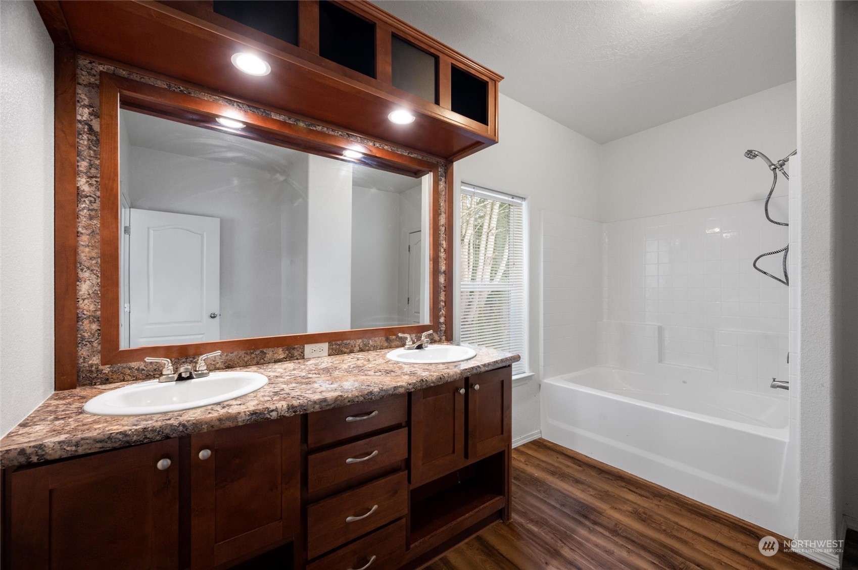 700 North Reed Street, Unit 21 Sedro-Woolley, WA 98284 - Photo 15 of 28 a bathroom with a granite countertop sink mirror and bathtub