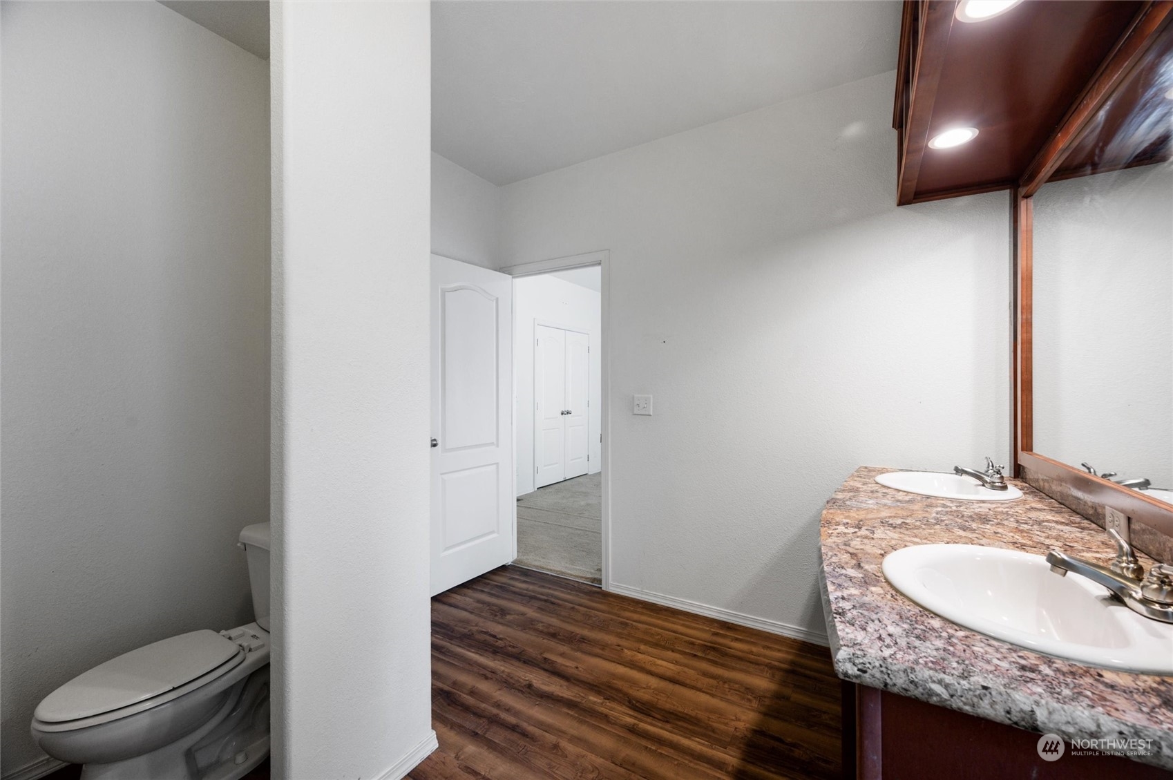 700 North Reed Street, Unit 21 Sedro-Woolley, WA 98284 - Photo 16 of 28 a bathroom with a granite countertop sink and a mirror