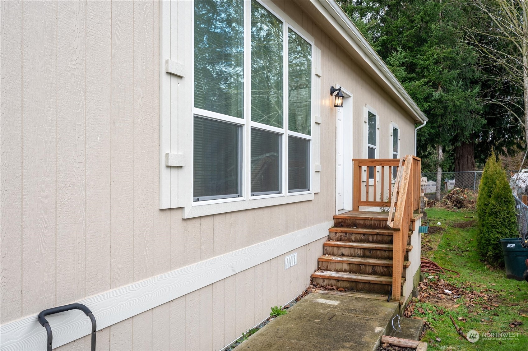 700 North Reed Street, Unit 21 Sedro-Woolley, WA 98284 - Photo 2 of 28 a view of a house with backyard and deck