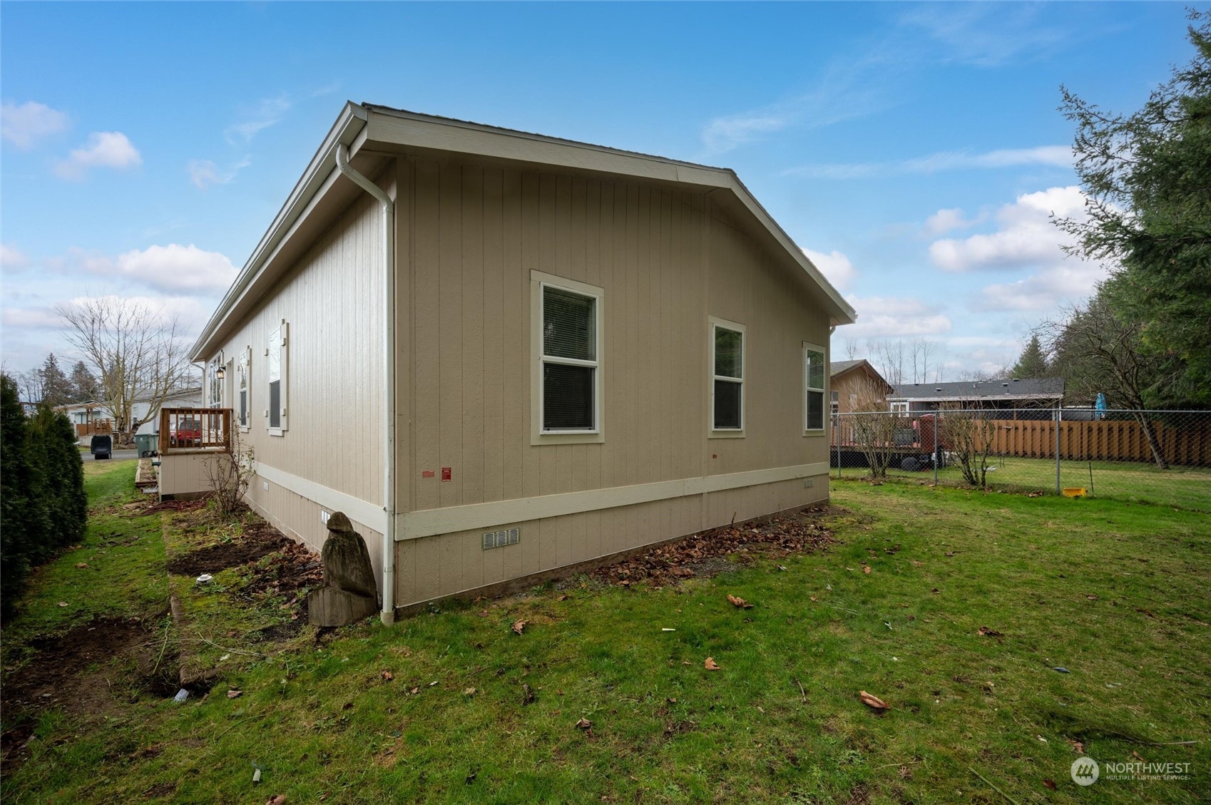 700 North Reed Street, Unit 21 Sedro-Woolley, WA 98284 - Photo 25 of 28 a view of a backyard with plants and a garden