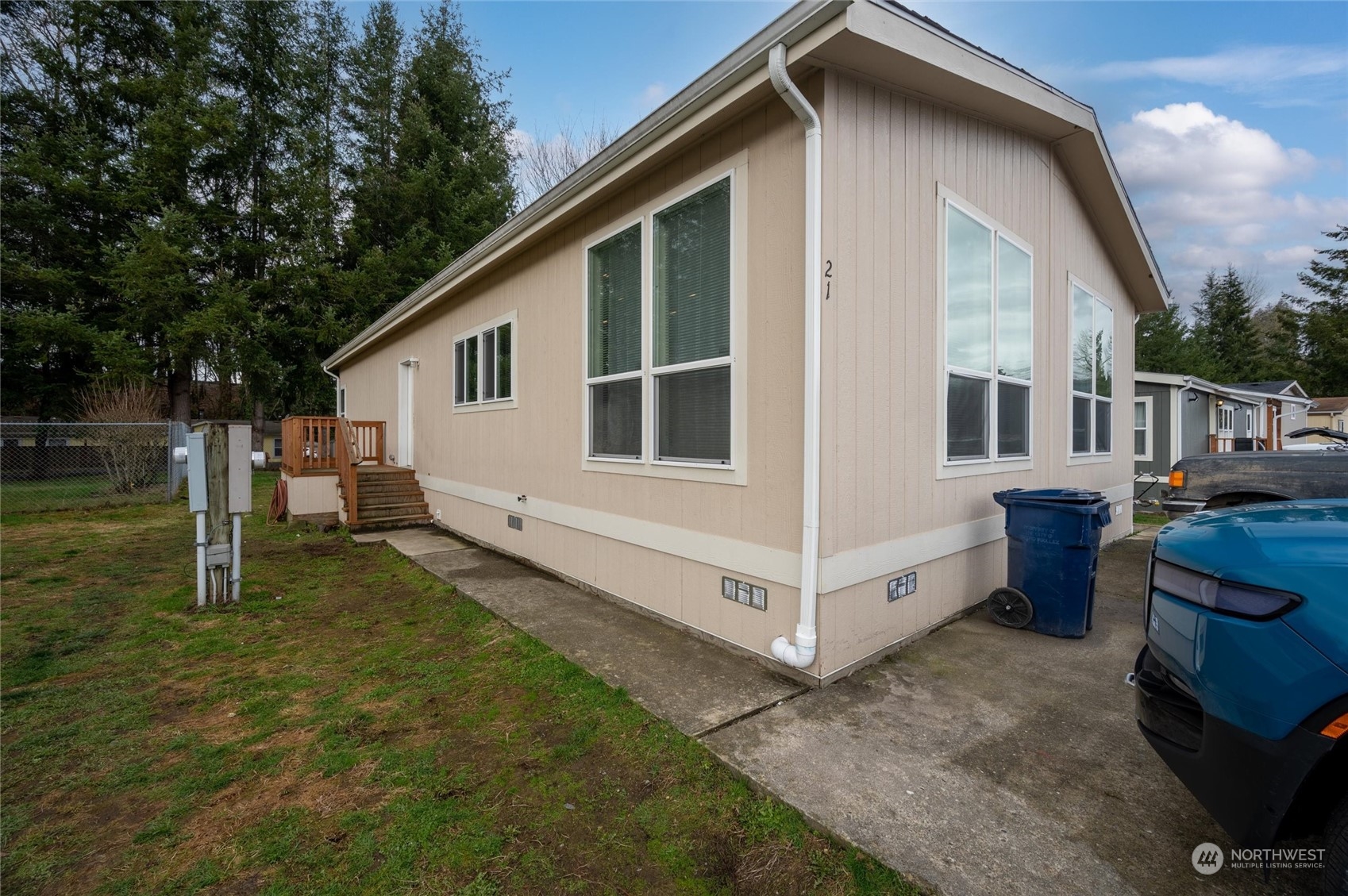 700 North Reed Street, Unit 21 Sedro-Woolley, WA 98284 - Photo 4 of 28 a view of a house with backyard and sitting area