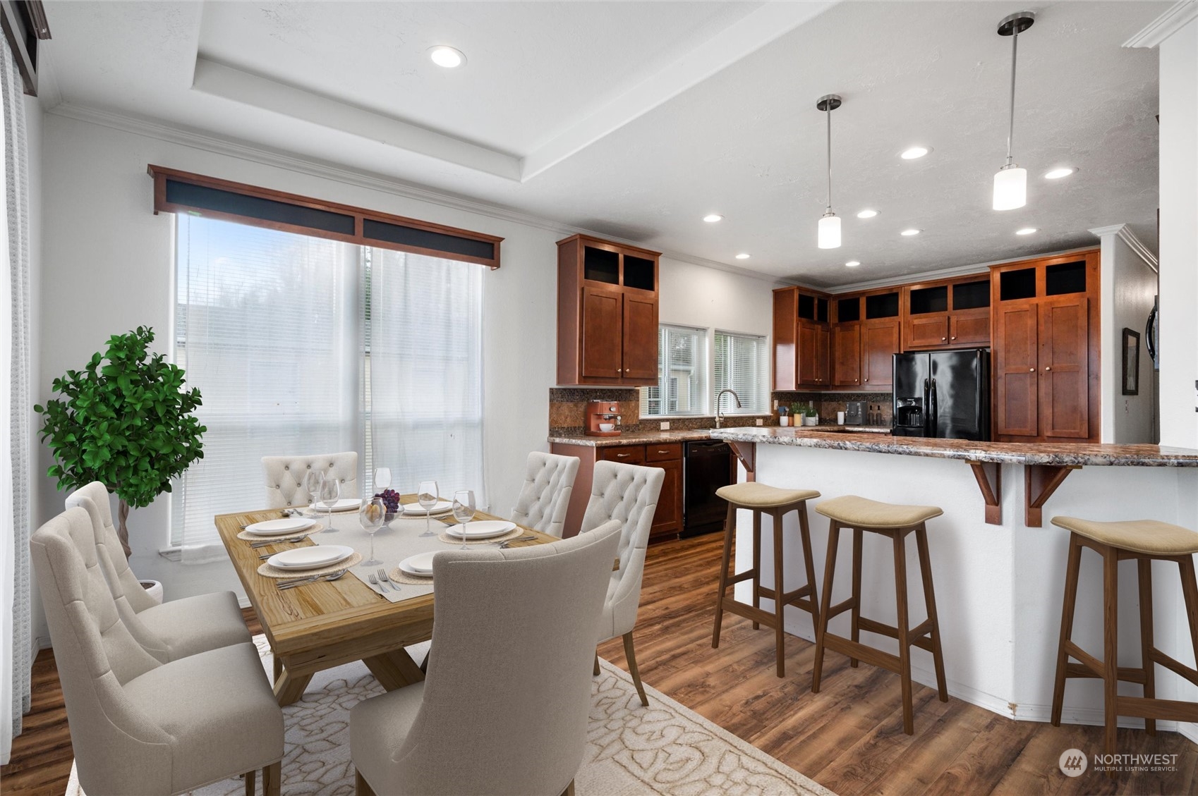 700 North Reed Street, Unit 21 Sedro-Woolley, WA 98284 - Photo 8 of 28 a dining room with furniture a large window and a chandelier