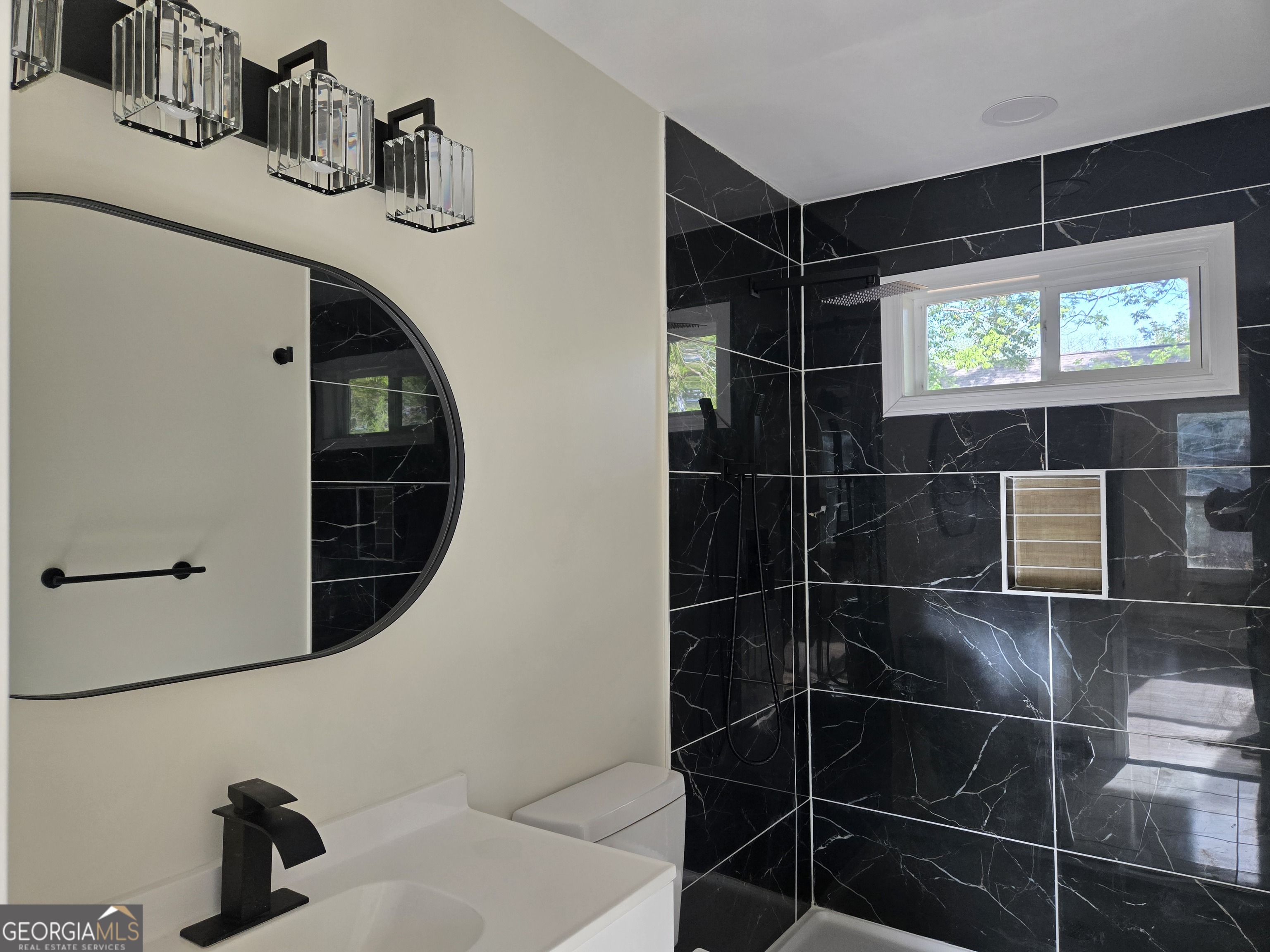 74 Carver Road McDonough, GA 30253 - Photo 12 of 19 a bathroom with a sink and a mirror