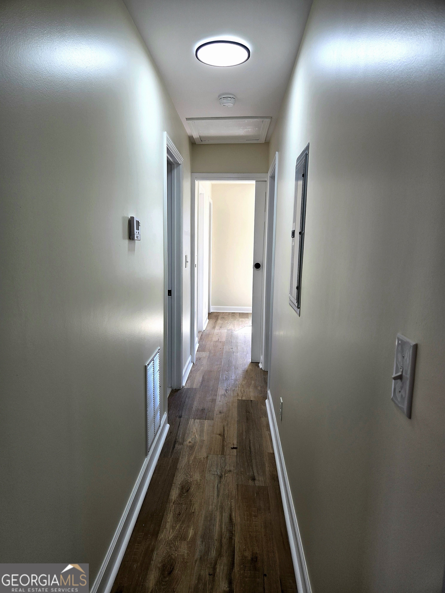 74 Carver Road McDonough, GA 30253 - Photo 15 of 19 a view of a hallway with wooden floor and staircase