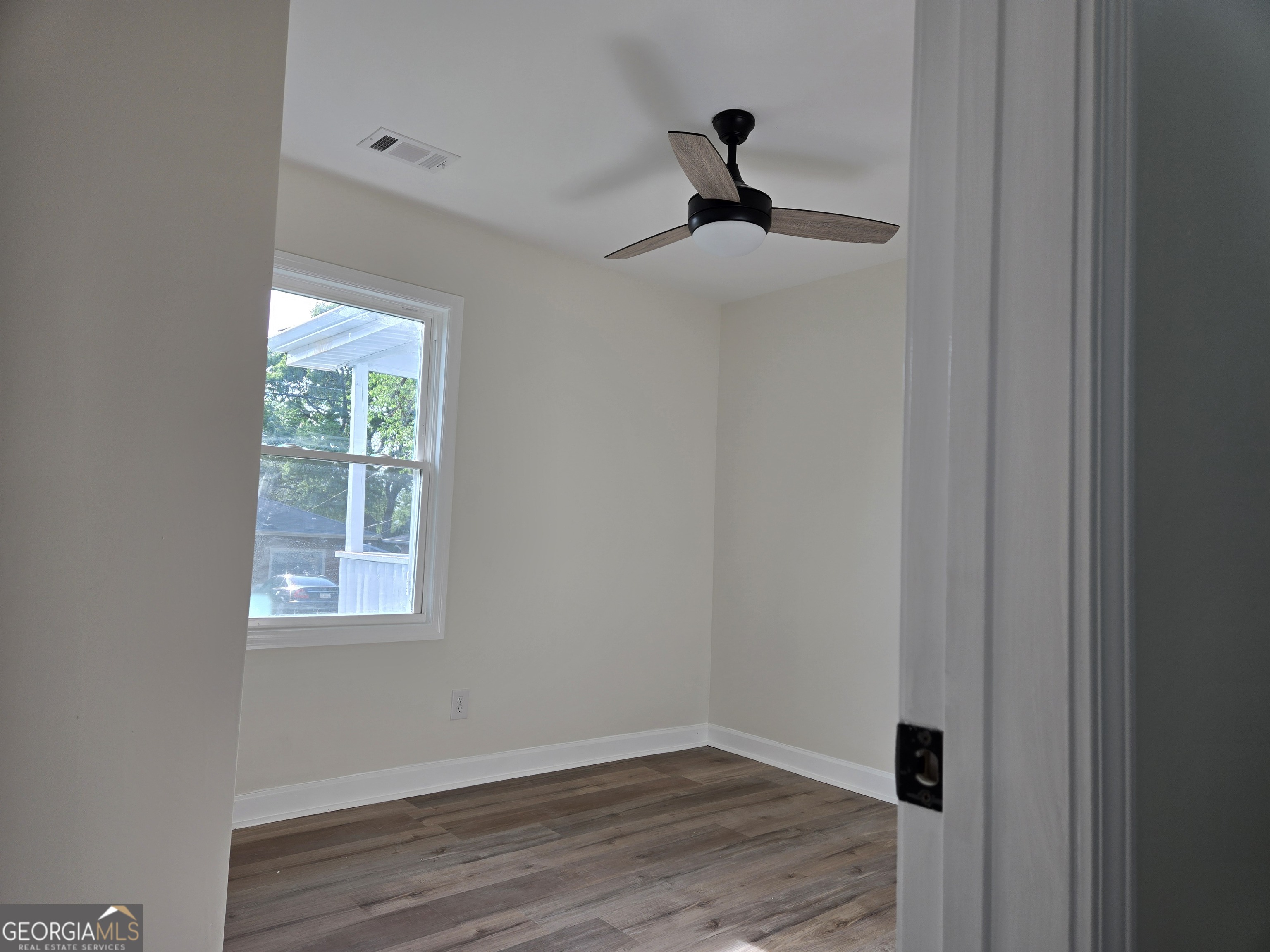 74 Carver Road McDonough, GA 30253 - Photo 19 of 19 a view of empty room with wooden floor