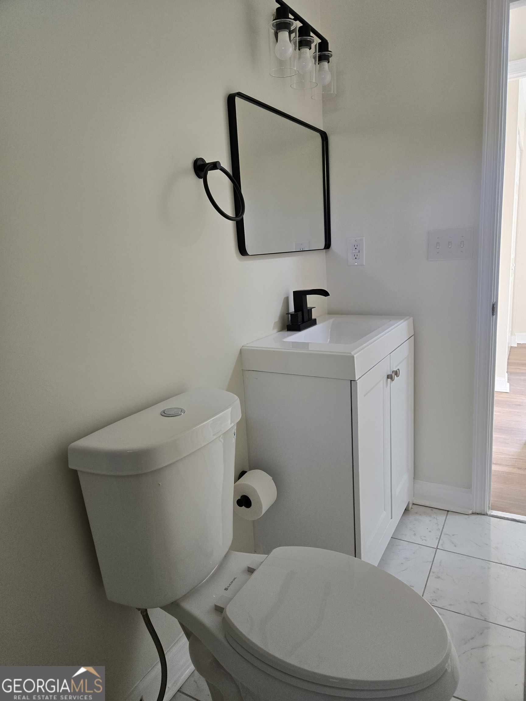 74 Carver Road McDonough, GA 30253 - Photo 9 of 19 a bathroom with a toilet and a sink