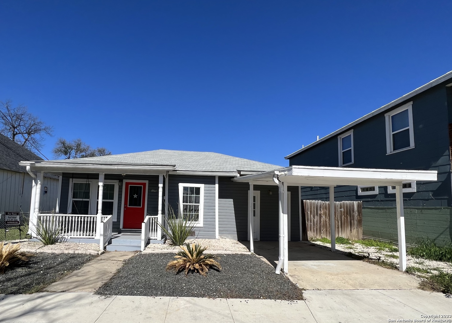 a front view of a house with a patio
