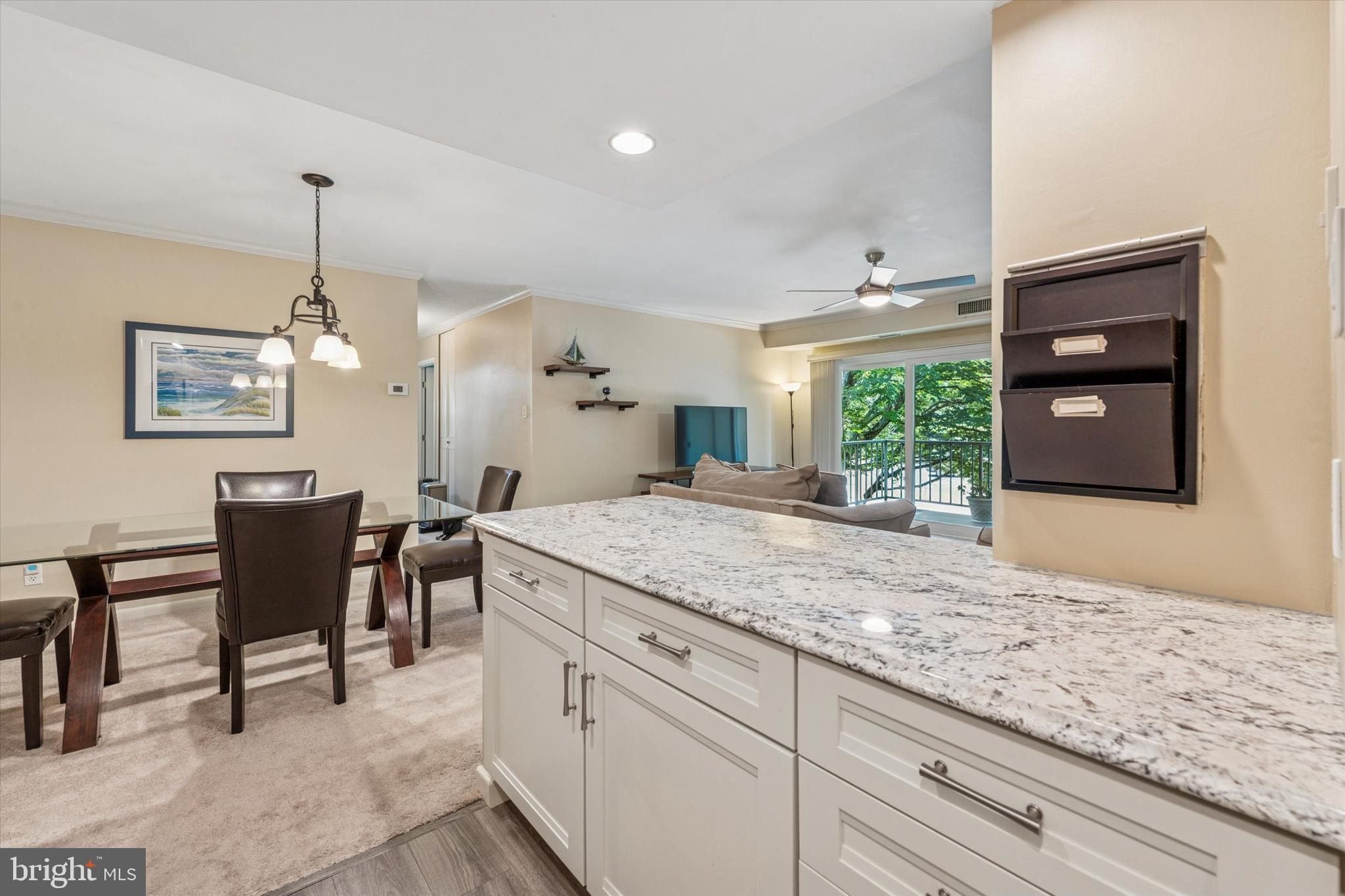 290 Old Forge Crossing, Unit 290 Devon, PA 19333 - Photo 11 of 28 a view of living room kitchen island furniture and a chandelier