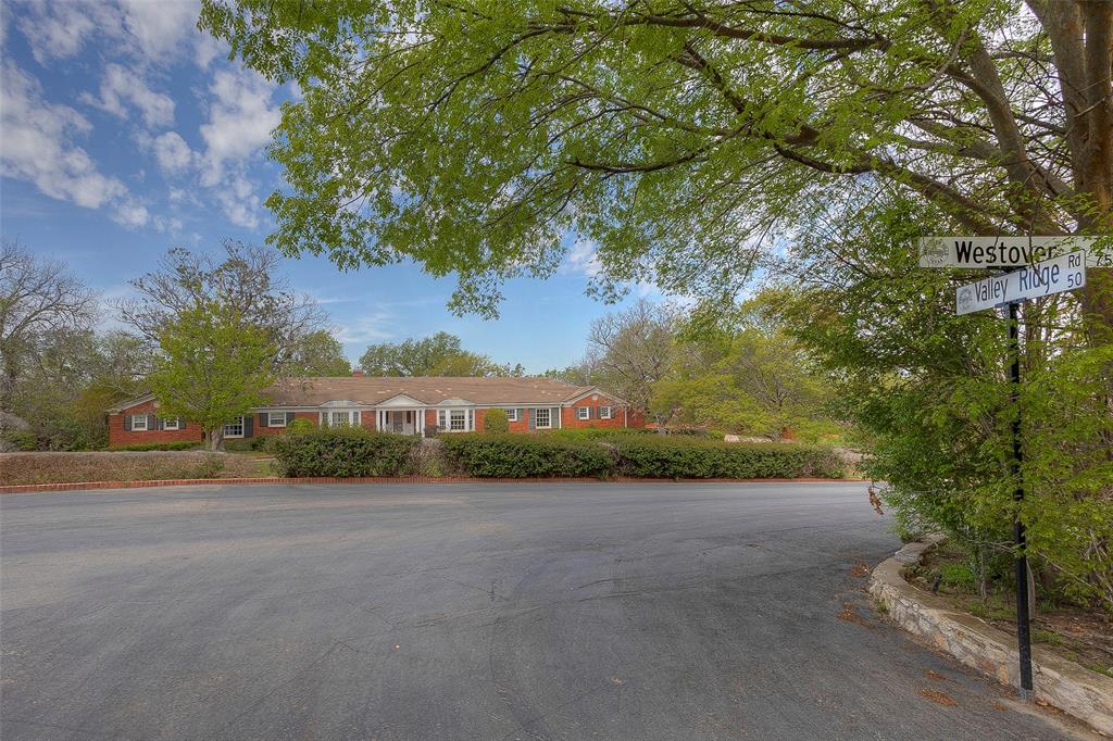 a view of a road and a yard