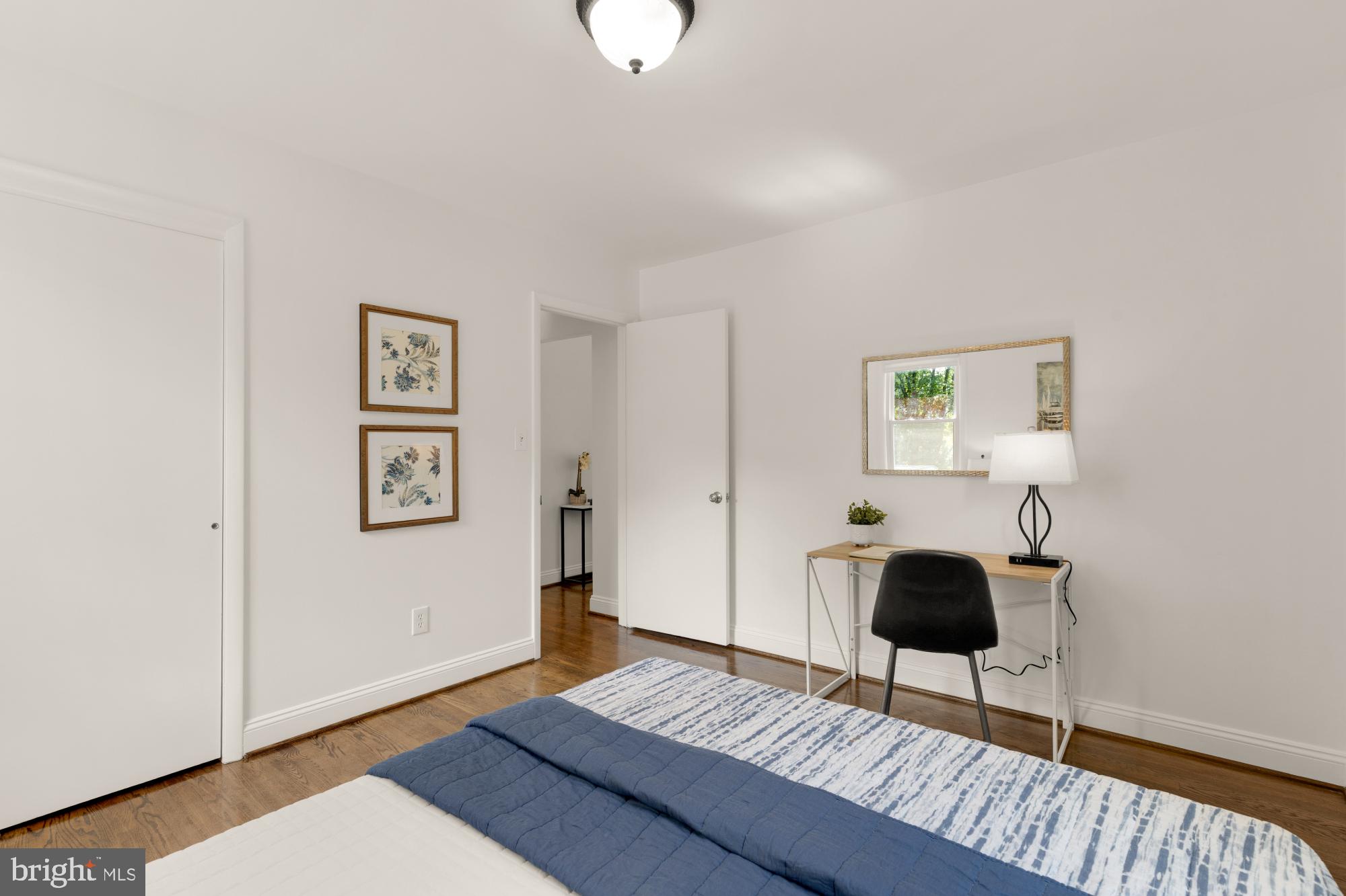 9811 Dallas Avenue Silver Spring, MD 20901 - Photo 17 of 45 a workspace with furniture and wooden floor