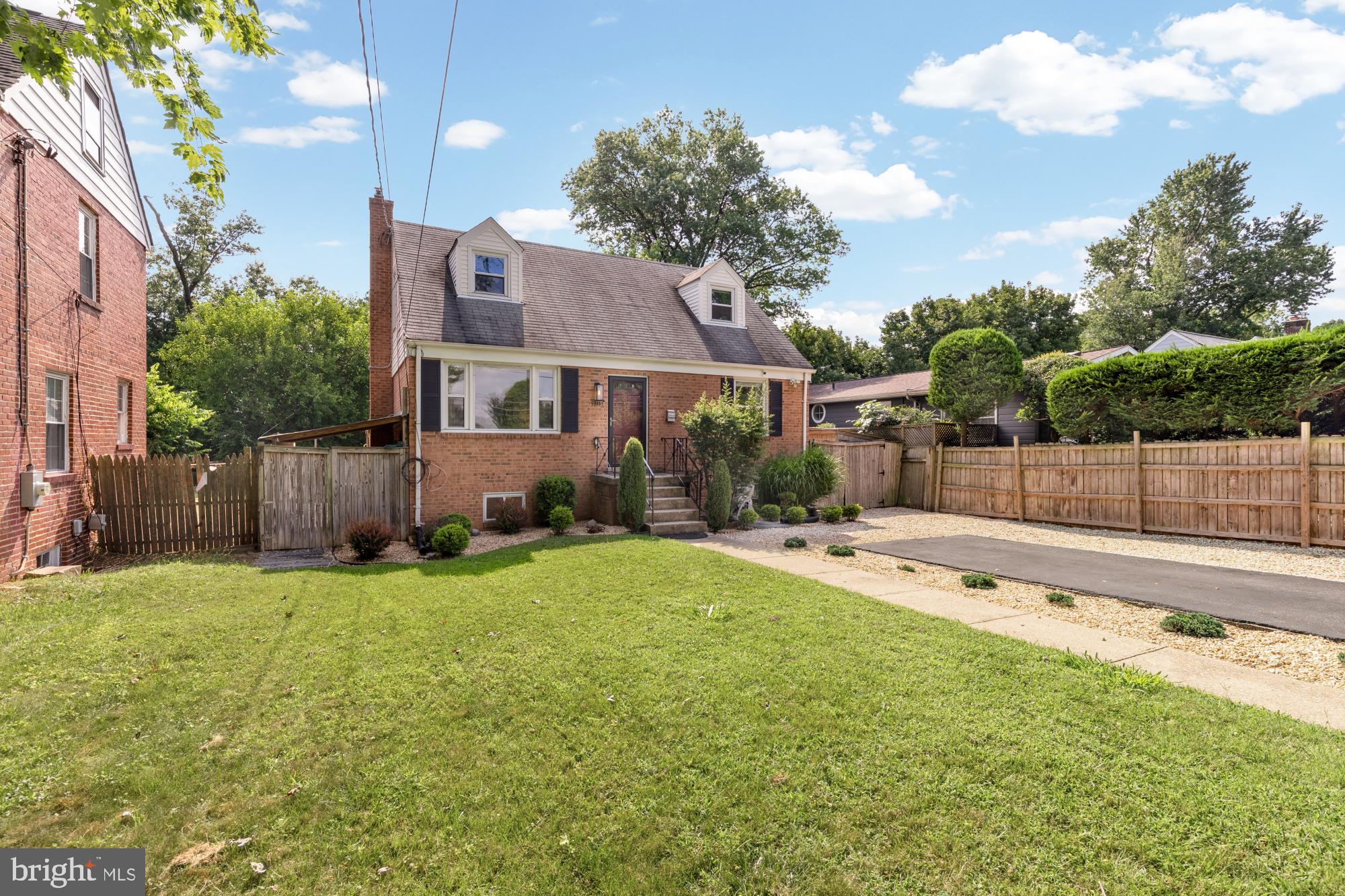 9811 Dallas Avenue Silver Spring, MD 20901 - Photo 2 of 45 a view of a house with a backyard and a tree