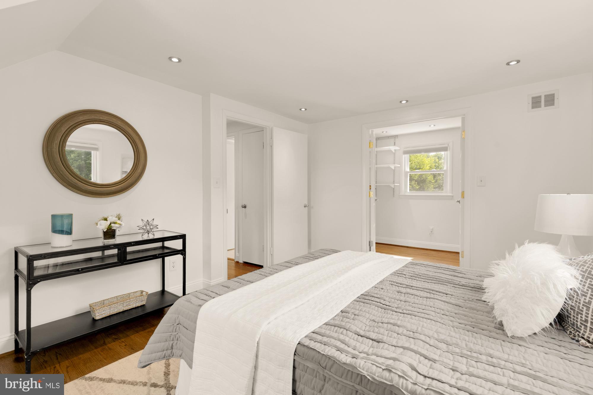 9811 Dallas Avenue Silver Spring, MD 20901 - Photo 21 of 45 a bedroom with a bed and a lamp on dresser