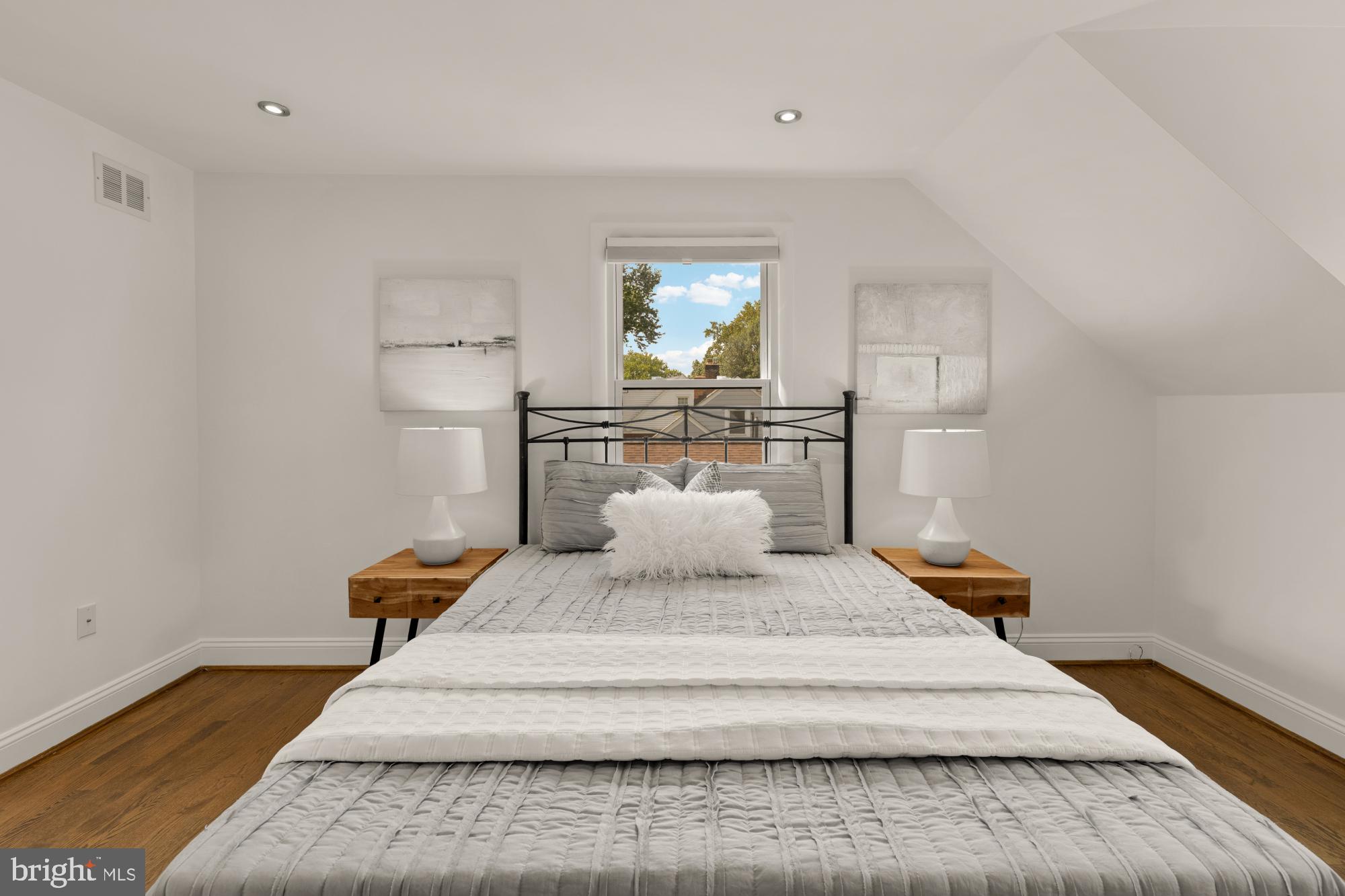 9811 Dallas Avenue Silver Spring, MD 20901 - Photo 22 of 45 a large white bed in a white room