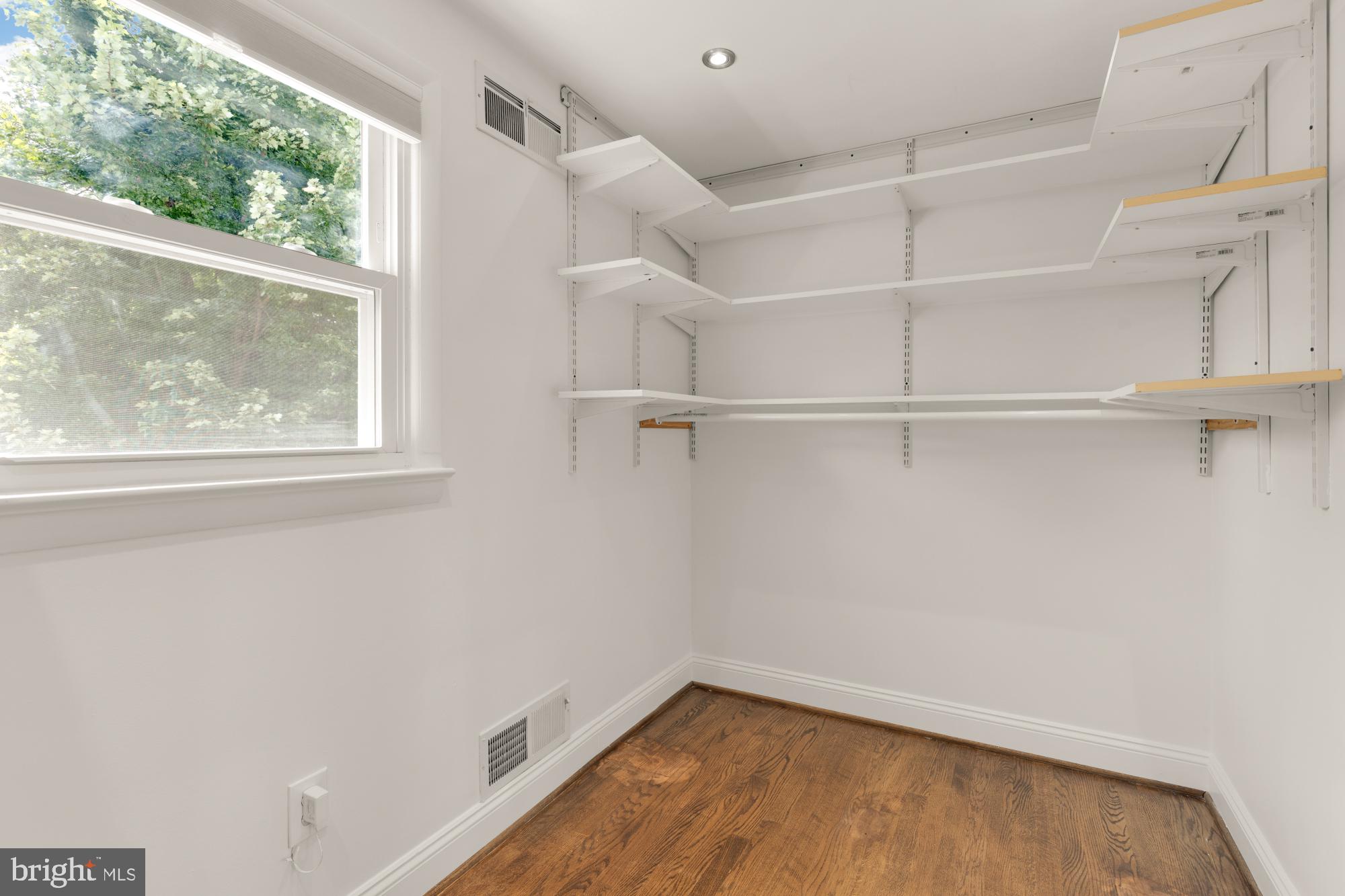 9811 Dallas Avenue Silver Spring, MD 20901 - Photo 24 of 45 a view of a room with rack on the wall and a window