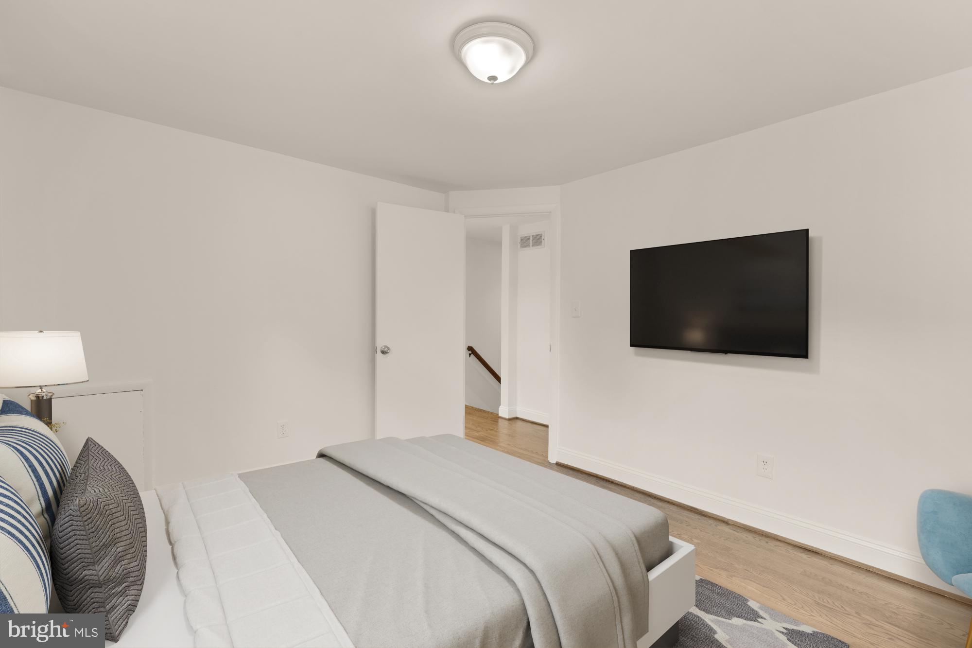 9811 Dallas Avenue Silver Spring, MD 20901 - Photo 25 of 45 a bedroom with a bed and a flat screen tv