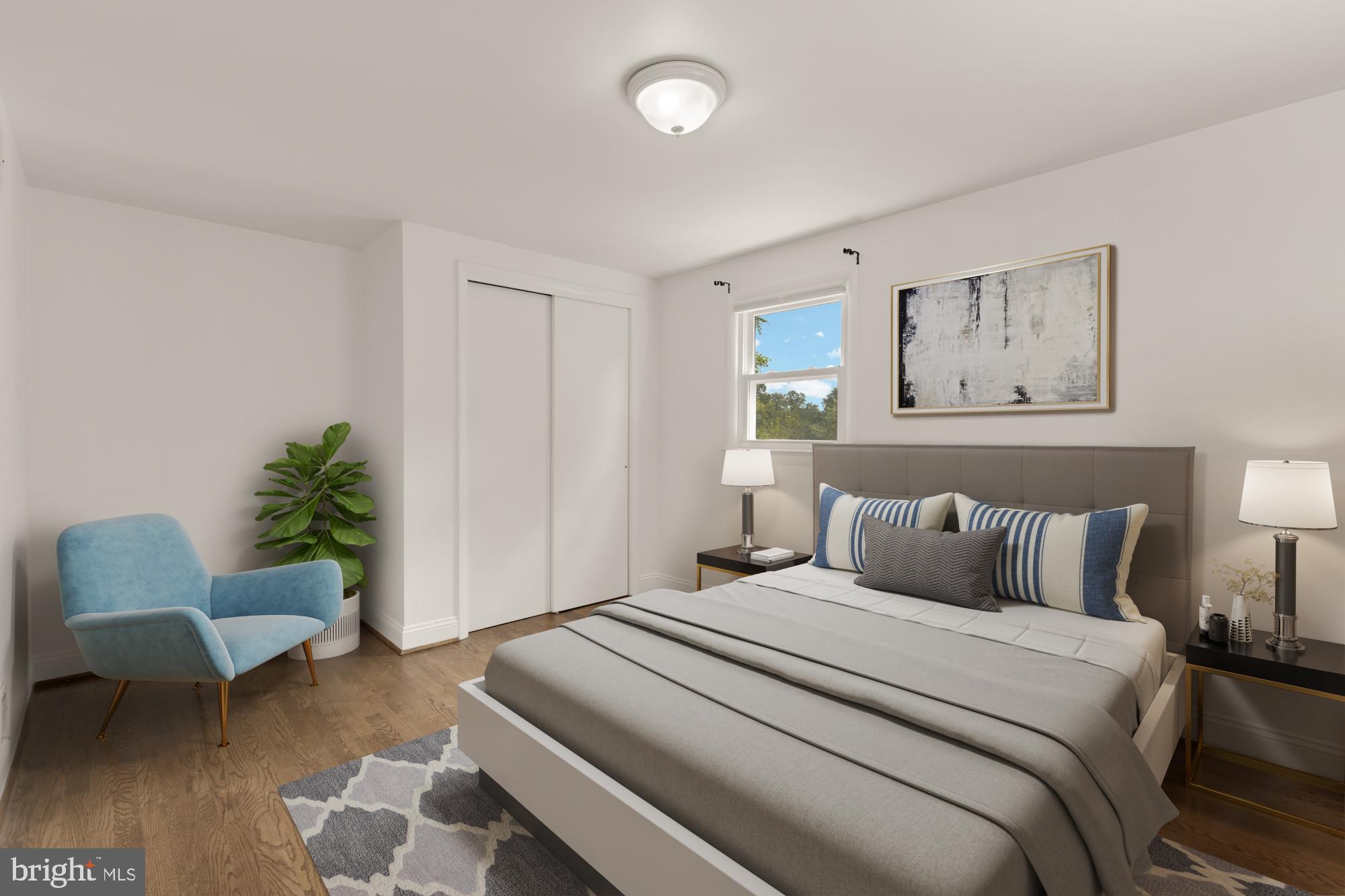 9811 Dallas Avenue Silver Spring, MD 20901 - Photo 26 of 45 a bedroom with bed and a couch