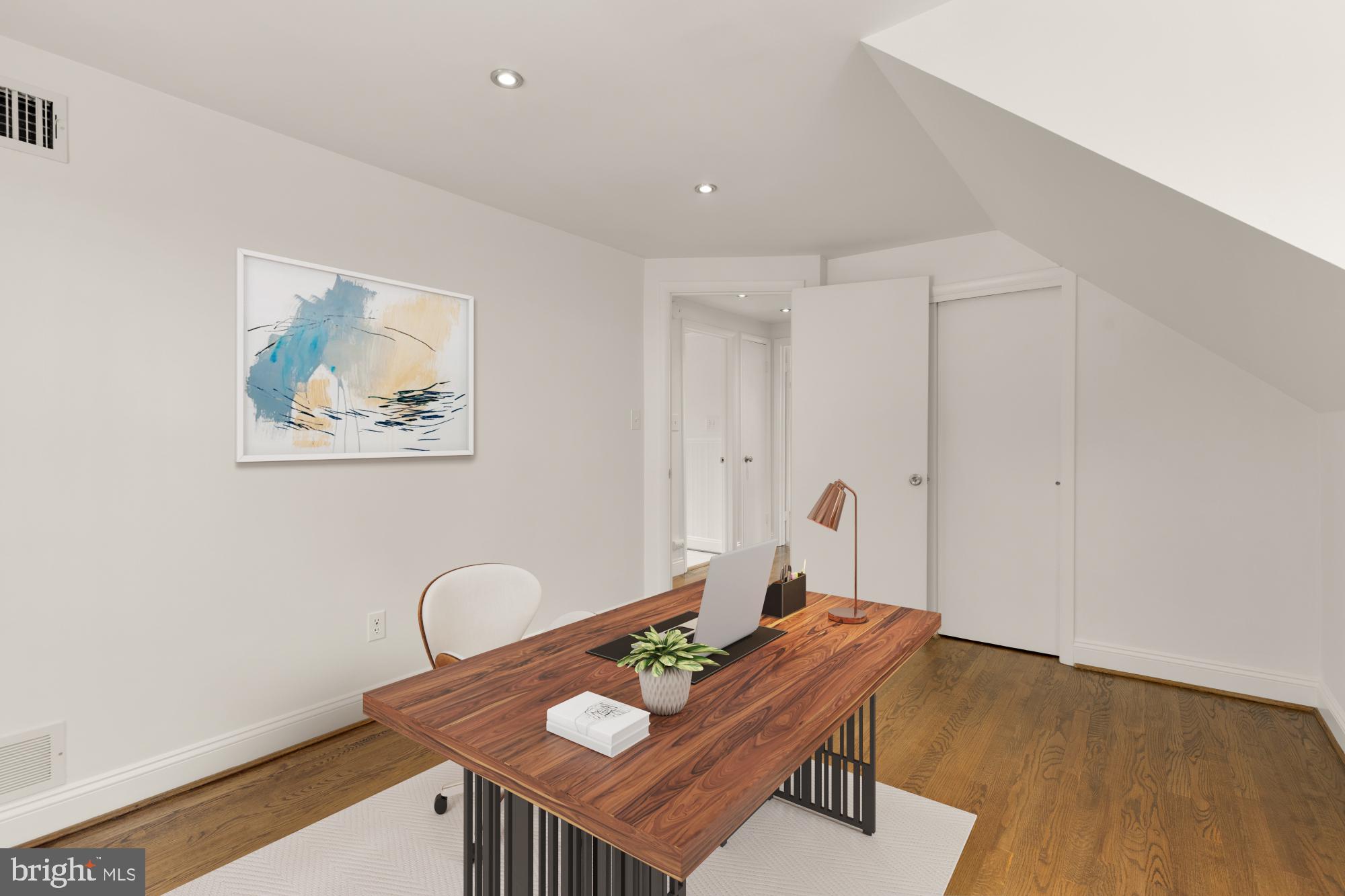 9811 Dallas Avenue Silver Spring, MD 20901 - Photo 27 of 45 a view of a workspace with furniture and wooden floor