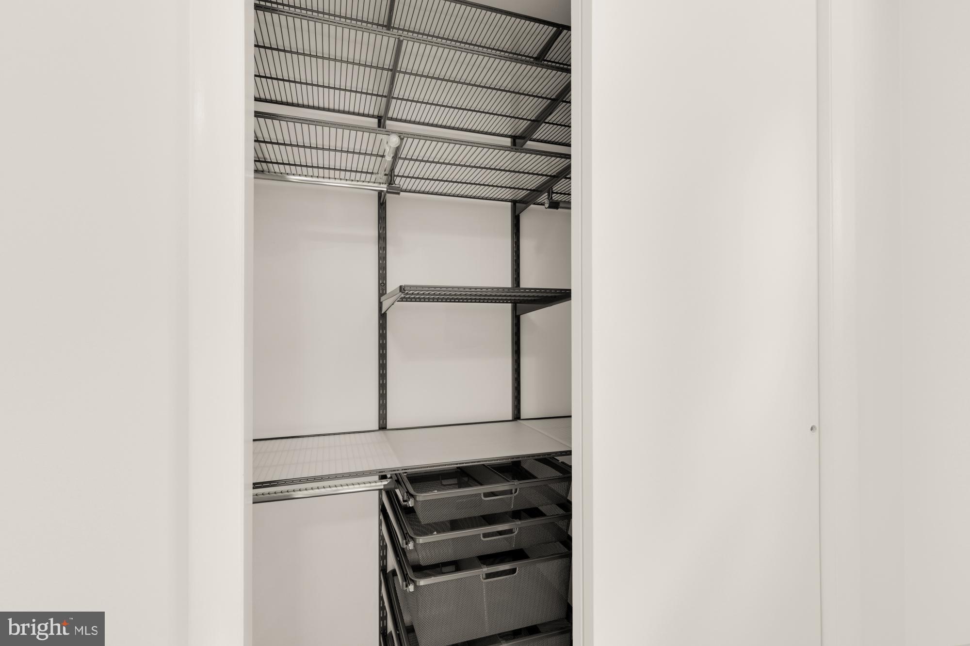 9811 Dallas Avenue Silver Spring, MD 20901 - Photo 29 of 45 a view of storage and utility room with racks on the wall