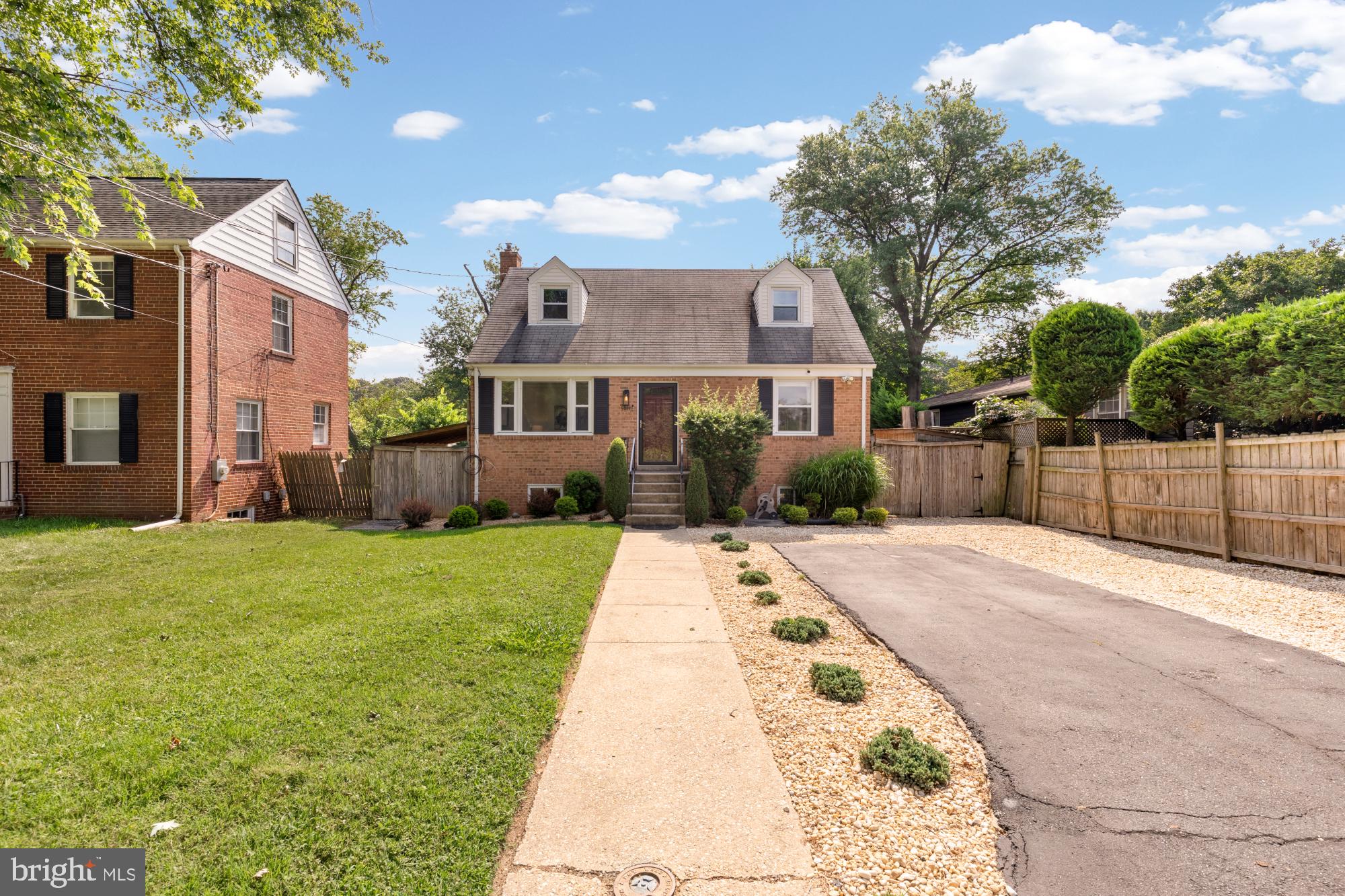 9811 Dallas Avenue Silver Spring, MD 20901 - Photo 3 of 45 a front view of a house with a garden