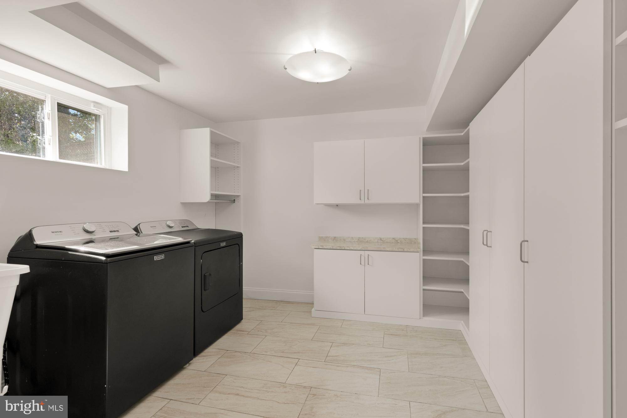 9811 Dallas Avenue Silver Spring, MD 20901 - Photo 36 of 45 a room with a cabinets and appliances