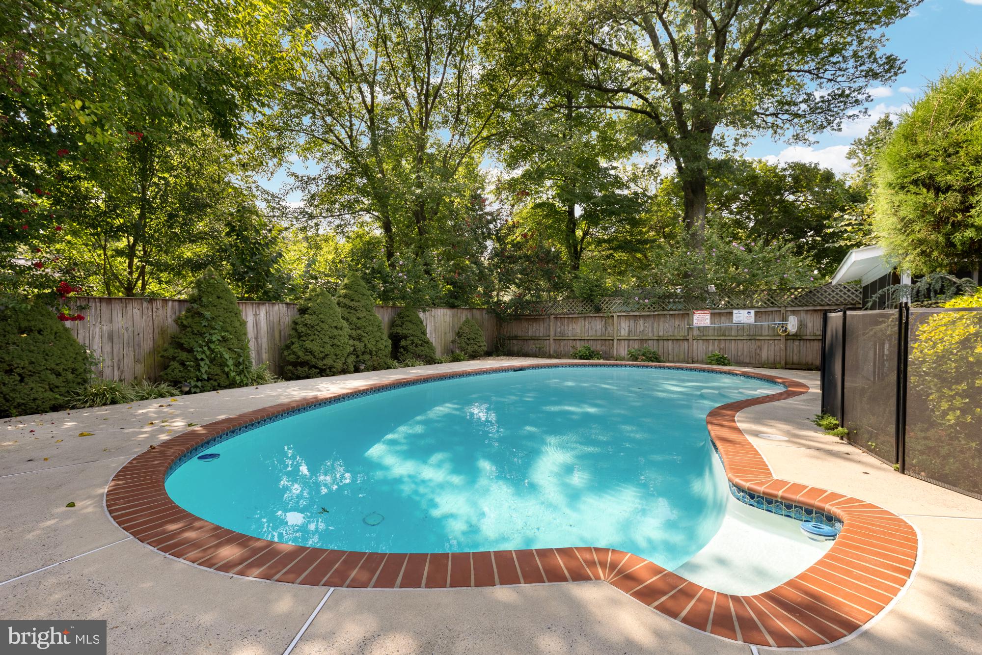 9811 Dallas Avenue Silver Spring, MD 20901 - Photo 40 of 45 a view of a swimming pool with a patio